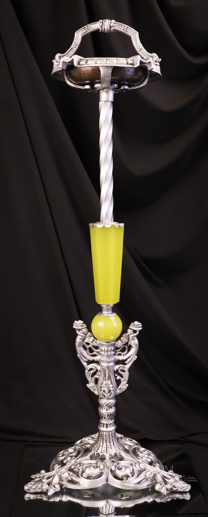 Art Deco Uranium Houze Glass Smoking Stand: An eye-catching antique Art Deco uranium-rich Houze glass-accented smoking stand. This piece is marked "Pat Appl for E-182." The stand measures 29" tall and 10" wide. The metal has been refinished to