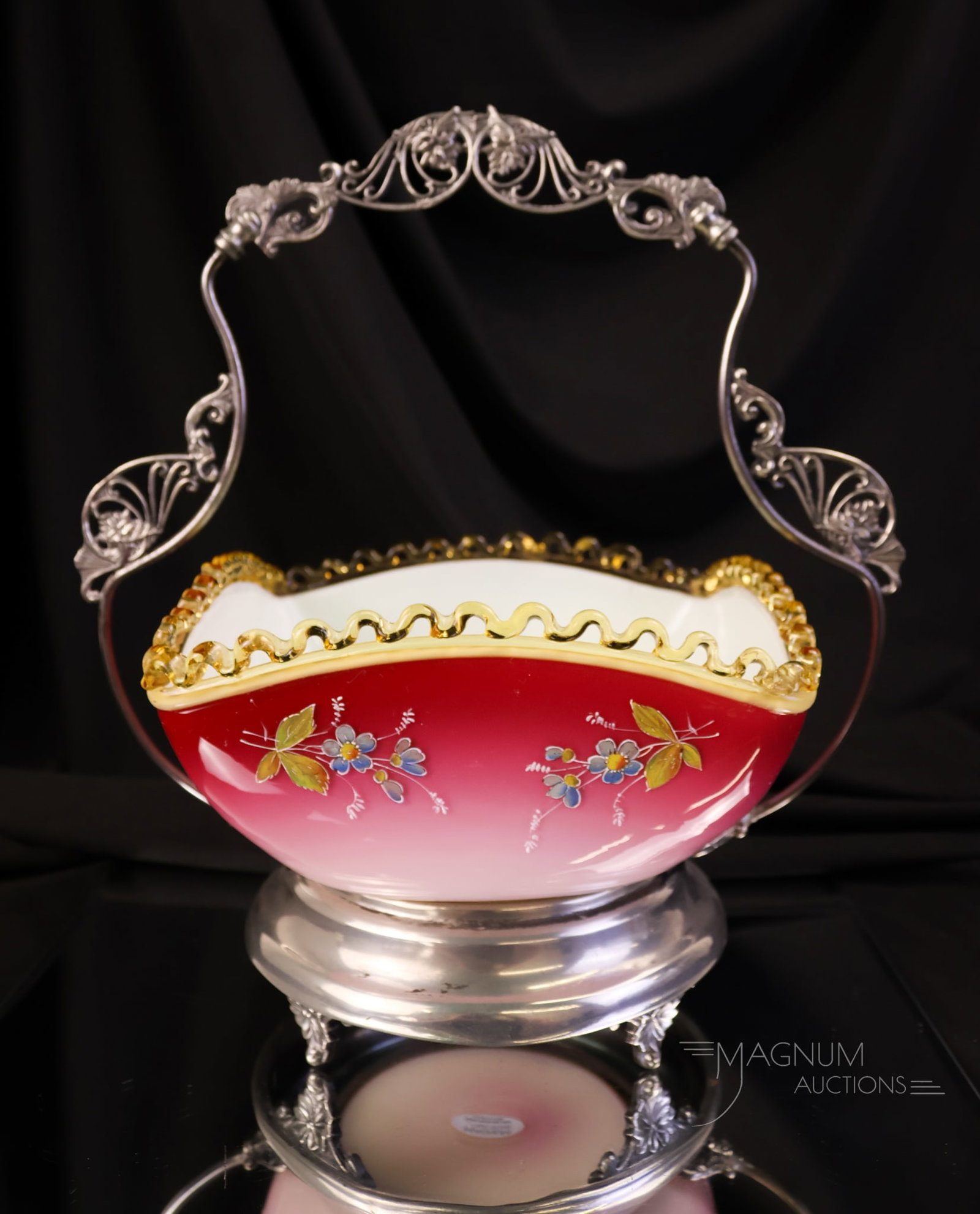 Miami Silverplate Co. Victorian Peachblow Uranium Glass Decorated Brides Basket Bowl: A glowing find in a Victorian peachblow cased uranium-rich bride's bowl set in a signed Miami Silver Co. basket. The bowl has an applied amber rigaree rim. The piece measures 11" tall and 10 1/4" wide