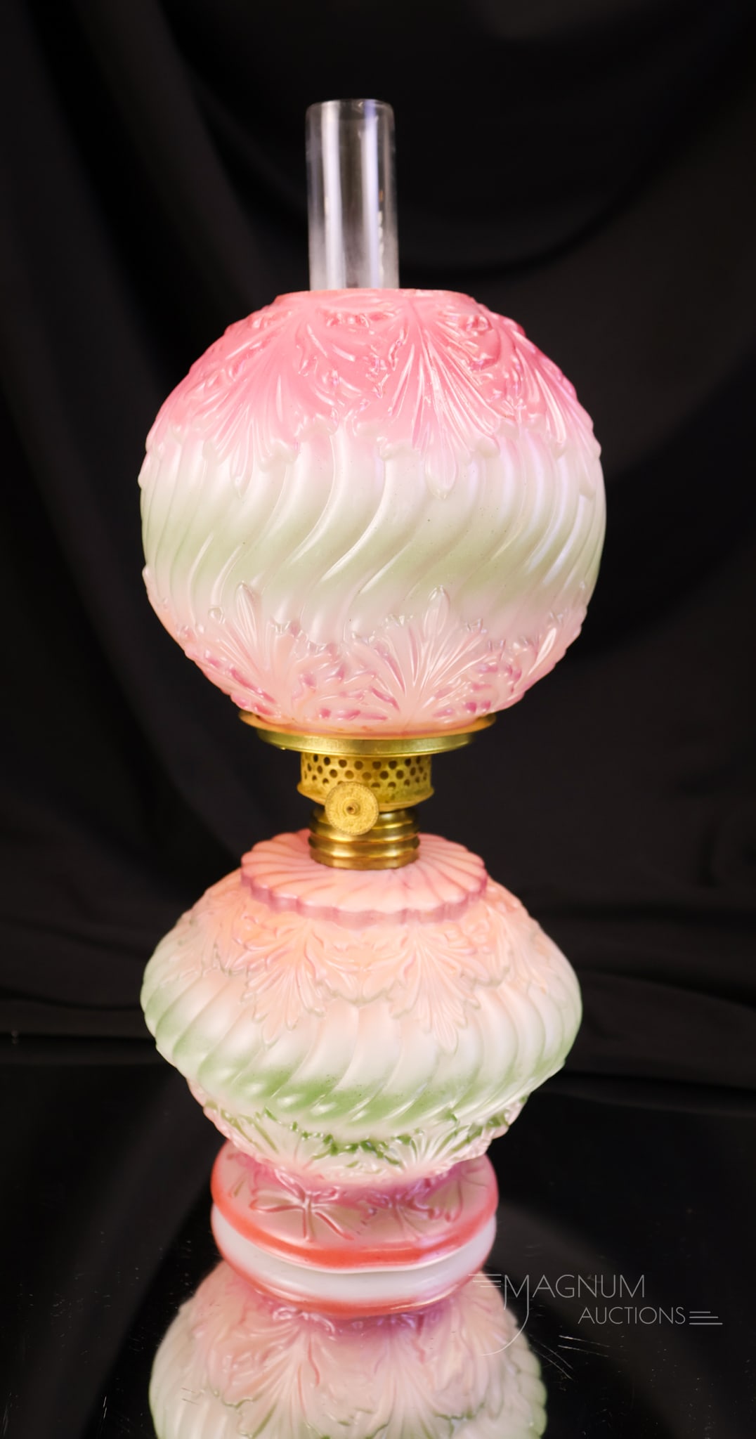 Victorian Pink & Green Opal Glass Miniature Oil Lamp: A sweet little decorated opal glass Victorian miniature oil lamp. This lamp features an overlapping leaf design and is enameled with pink and green decoration. The lamp measures 8 3/4" tall.