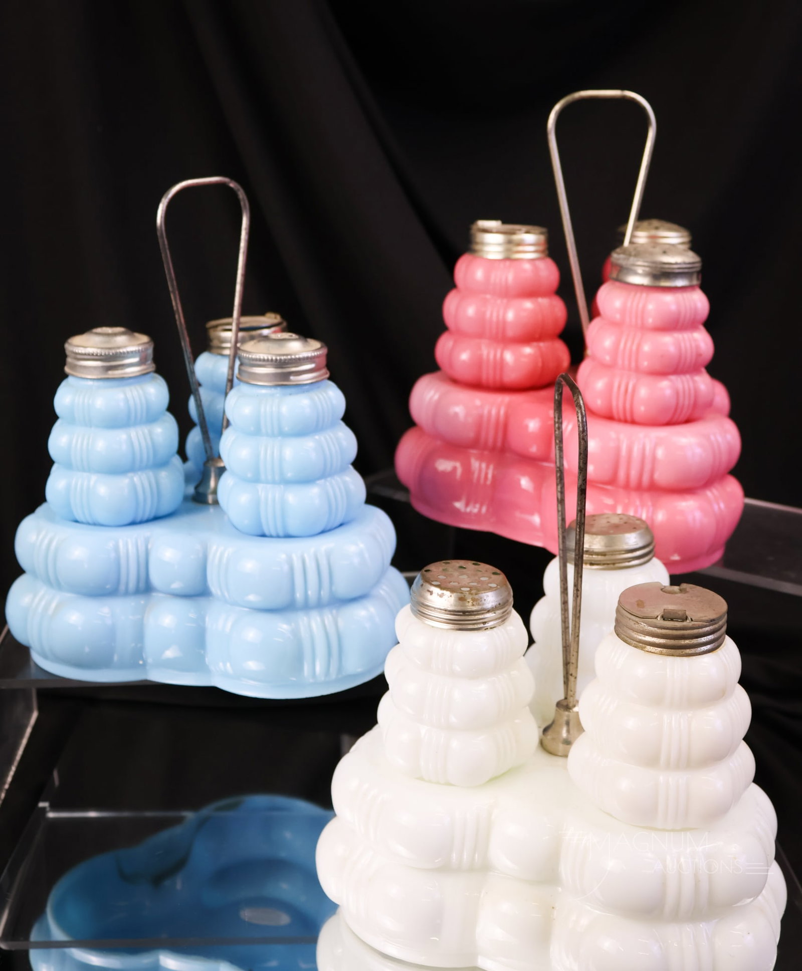 3 pc Lot Dithridge Creased Bale Victorian Glass Condiment Sets: A collection enhancing offering of three Victorian condiment sets in the Creased Bale pattern. This lot includes blue, pink, and white glass. The tallest measures 8".
