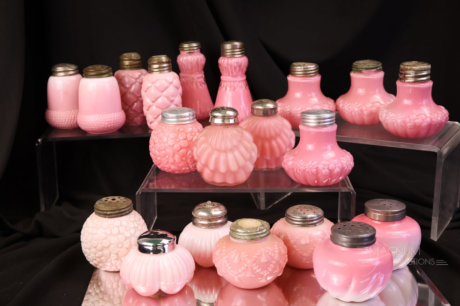 20 pc Lot Victorian Consolidated Dithridge Glass Salt Shakers: Ten complete pairs of Consolidated and Dithridge Victorian glass salt shakers make up this lot. All are in pink. The tallest measures 3 1/2".