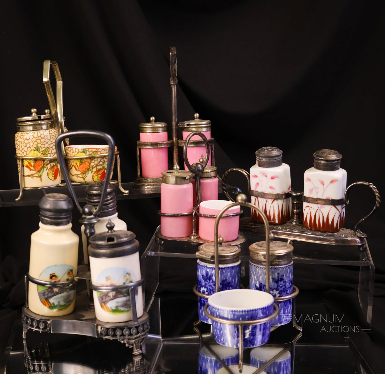 6 pc Lot Porcelain & Silverplate Victorian Shaker Condiment Sets: A six-piece offering of Victorian porcelain shaker and condiment sets. Makers include Crescent of England. The tallest measures 7 1/2".