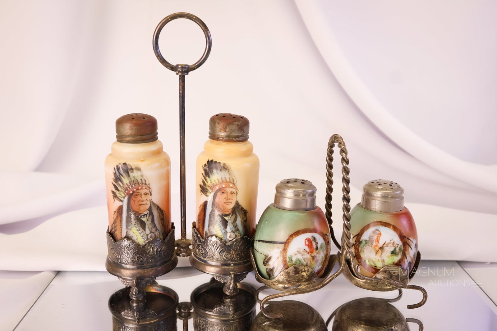 2 Pair Lot of Victorian Wave Crest Handel Native American Indian Decorated Salt Shakers: Two fine offerings in Victorian glass salt shaker pairs. The first is a Wave Crest pair in a Wilcox silverplated holder. These each feature a Native American Indian chief. The second set is a pair of 