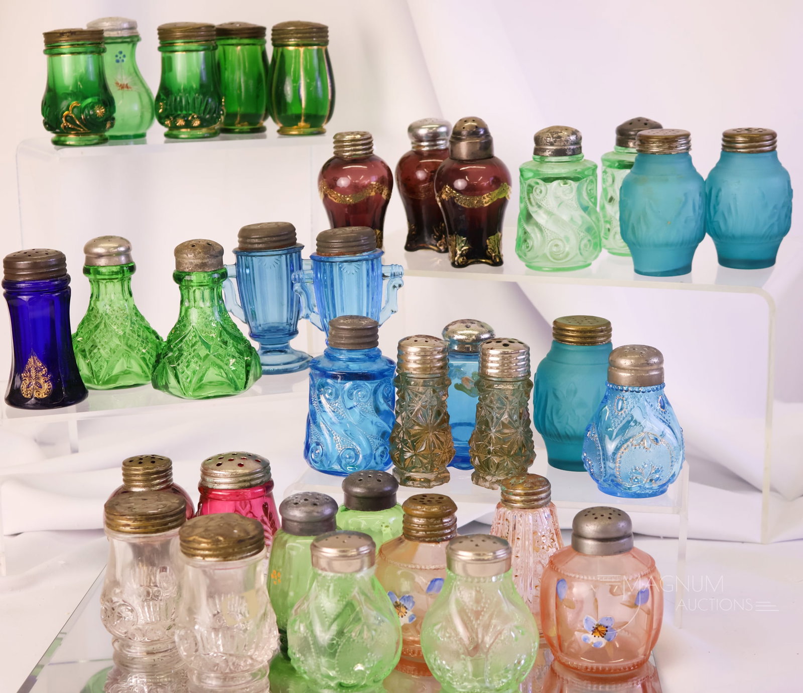 34 EAPG Victorian Glass Shakers Riverside Dugan Jefferson Tarentum and More Uranium: A huge lot of Victorian glass salt shakers. If you don't have it, it may be in here! This lot includes makers such as Dugan, Jefferson, Riverside, Tarentum, and more. Six green examples glow with thei