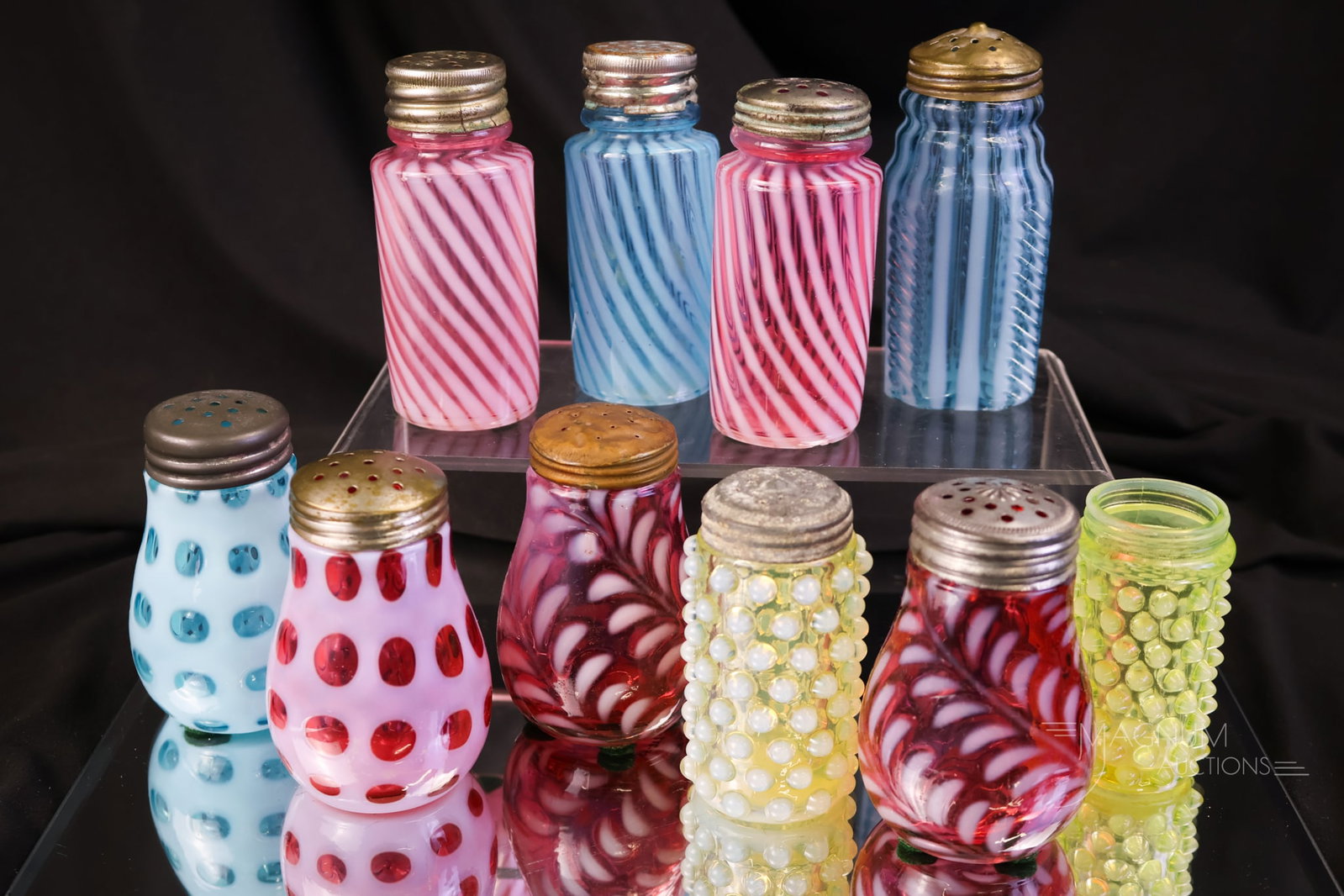 10 pc Lot Opalescent Victorian Glass Salt Shakers Northwood Hobbs & More Cranberry Blue Vaseline: Ten desirable finds in Victorian glass salt shakers. This lot includes makers such as Hobbs, Northwood, and more. Colors include cranberry, vaseline, and blue. The tallest measures 3 1/2".
