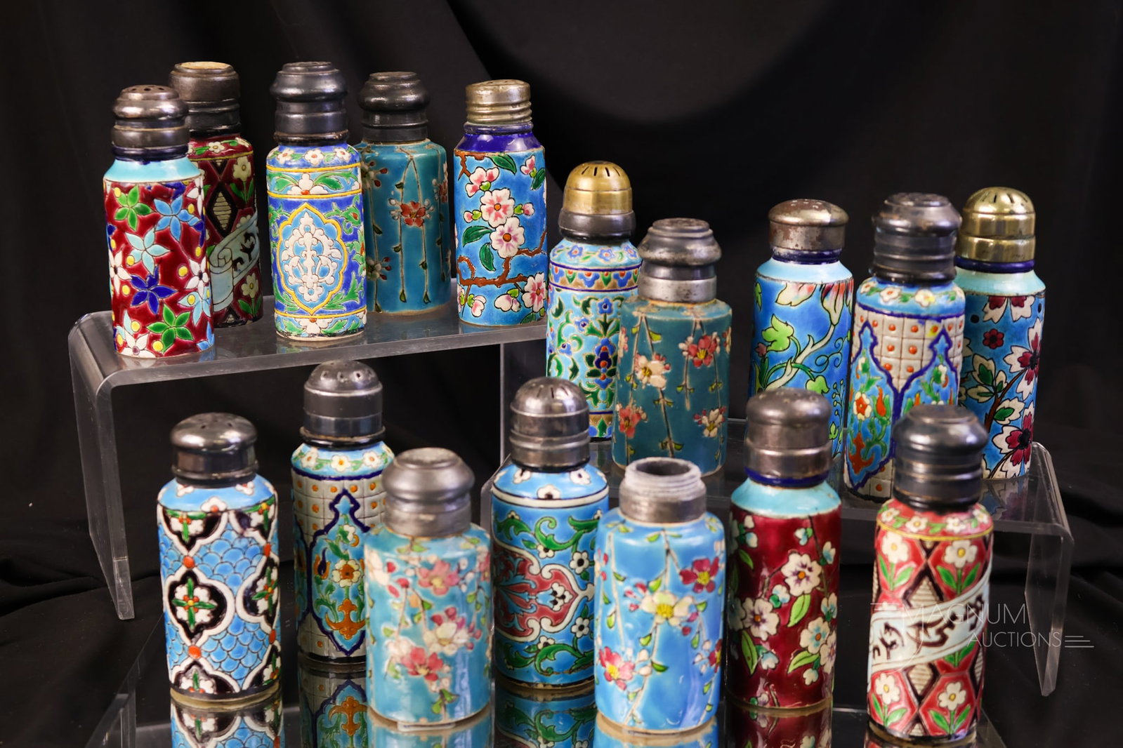 17 pc Longwy Victorian Pottery Salt Shakers: A generous offering of seventeen Victorian Longwy pottery salt shakers. There are four pairs in this lot. The tallest measures 4". One shaker exhibits a hairline in the body. One shaker exhibits a chi