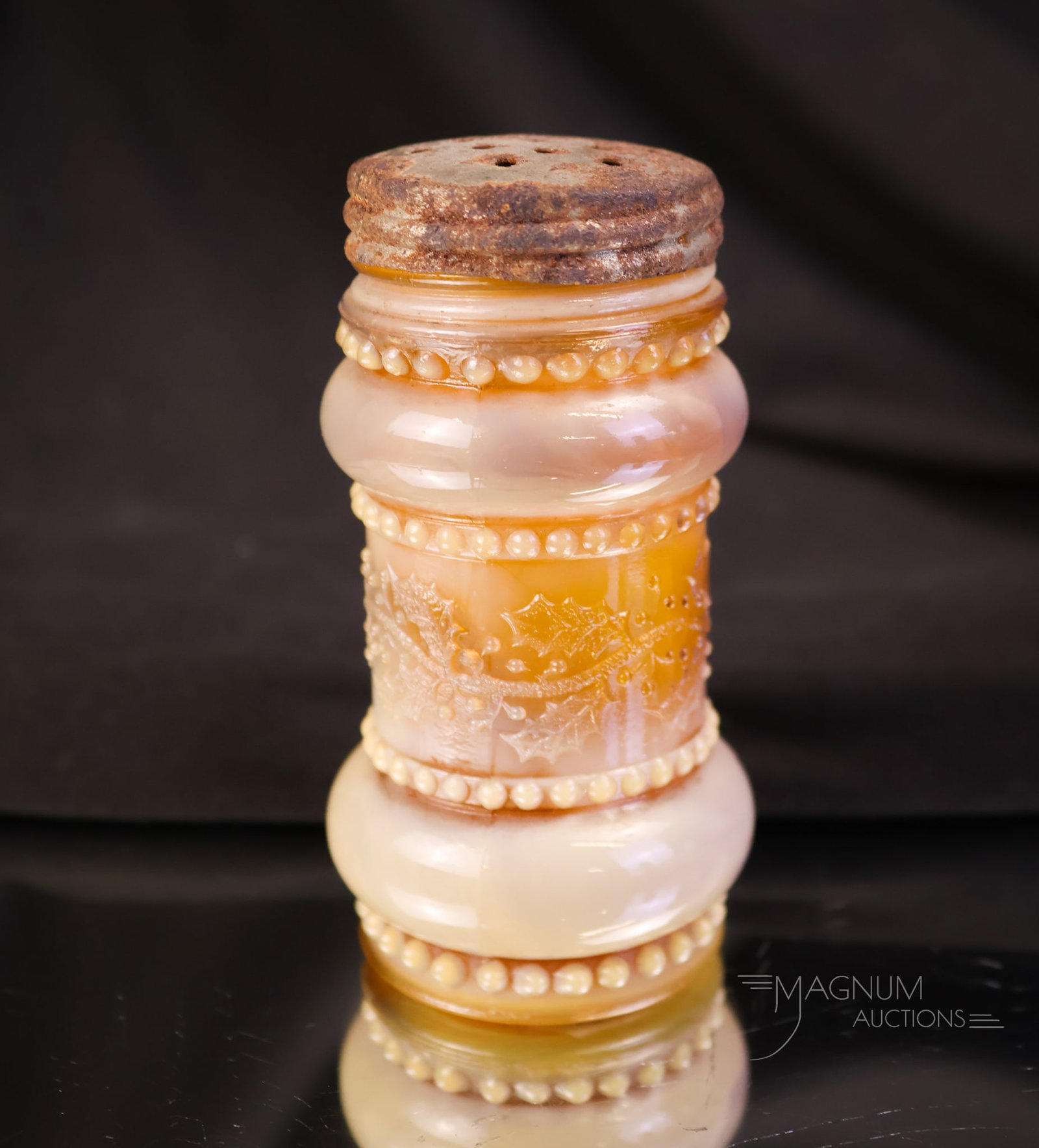 Victorian Greentown Holly Amber Glass Salt Shaker: A fine example of a Victorian Greentown Holly Amber glass salt shaker. This shaker has great coloring. The shaker measures 3" tall.