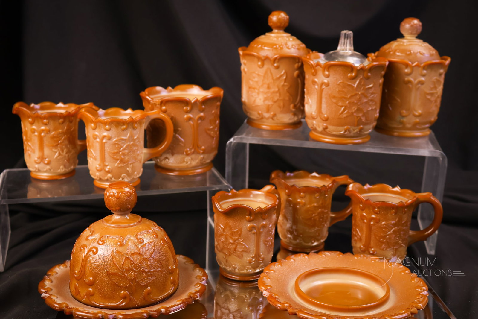 11 pc Lot McKee Victorian Chocolate & More Children's Glass: A select assortment of McKee Victorian children's chocolate glass and more. The tallest measures 4 1/2". The clear mustard lid exhibits a crack. The butter lid exhibits a rim chip. Both sugar lids hav