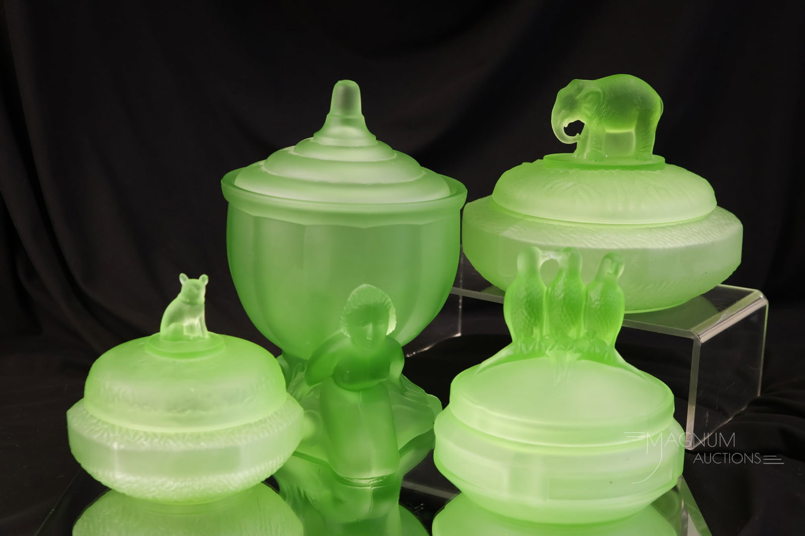 4 pc Lot Uranium Glowy Glass Powder Jars L.E. Smith & More: Four glowing finds for your Shiner cabinet. These are all uranium-rich powder jars. Each is a unique form. Examples by L.E. Smith and more.The tallest measures 6 1/2". The bulldog cover exhibits a nic