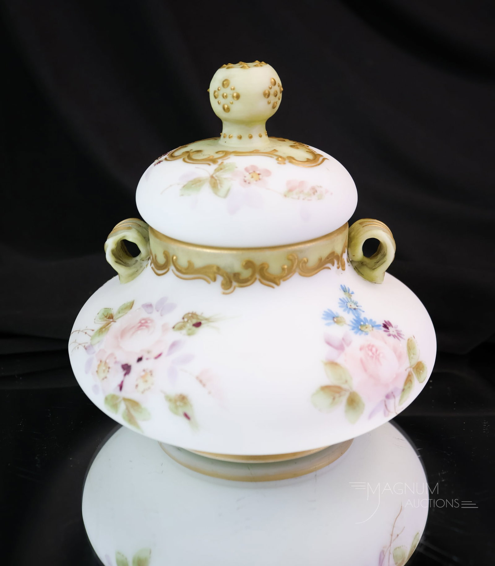 Signed Crown Milano Mt. Washington Dresden Flower Decorated Victorian Glass Temple Jar: A Fine Mt. Washington Victorian glass diminutive temple jar. This little gem measures only 4" tall. It is decorated with Dresden flowers. The piece has the addition of applied handles. This is a cabin