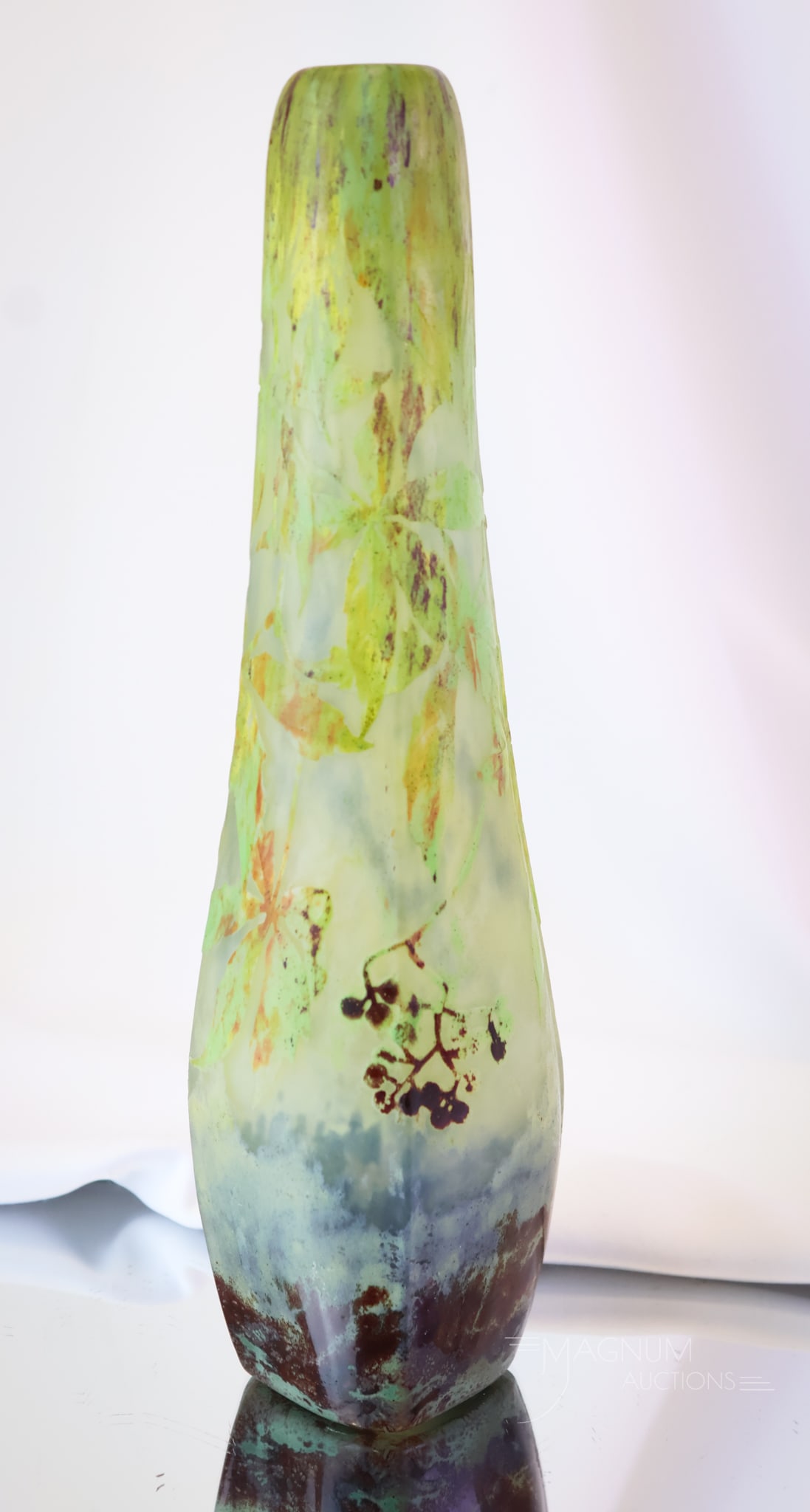 Signed Daum Nancy French Cameo Art Glass 11" Vase: A lovely find in signed Daum Nancy Art Glass. This is a cameo vase that measures 11" tall. It is decorated with foliage and berries on the body.