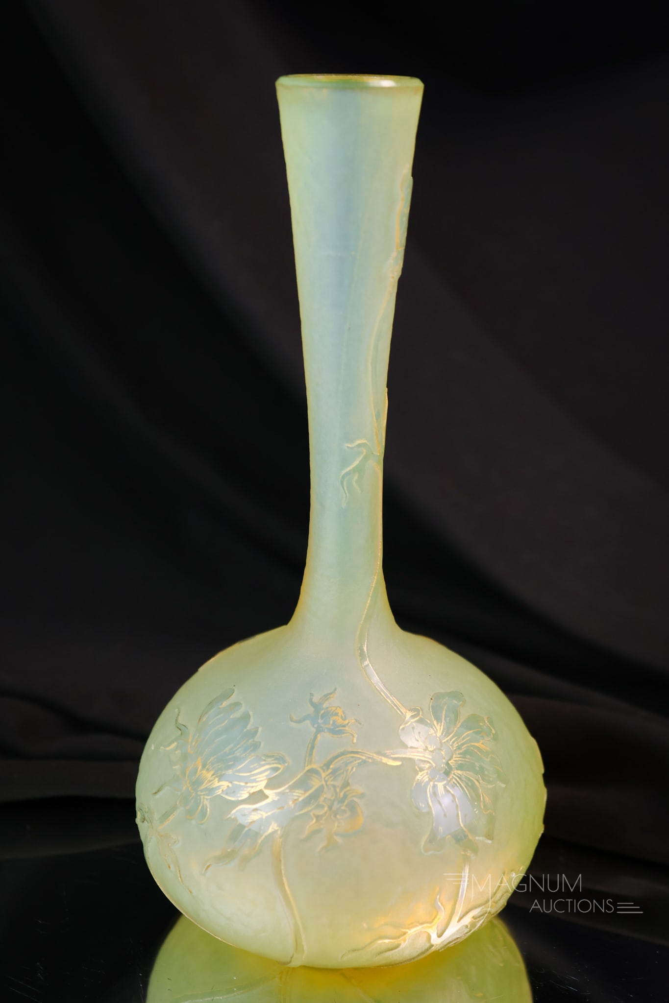 Signed Daum Nancy French Cameo Art Glass Vase: A select find in a signed Daum Nancy French cameo art glass vase. This vase has a yellow opal colored ground decorated with flowering vines. The vase measures 6 3/4" tall and 3 1/4" wide.