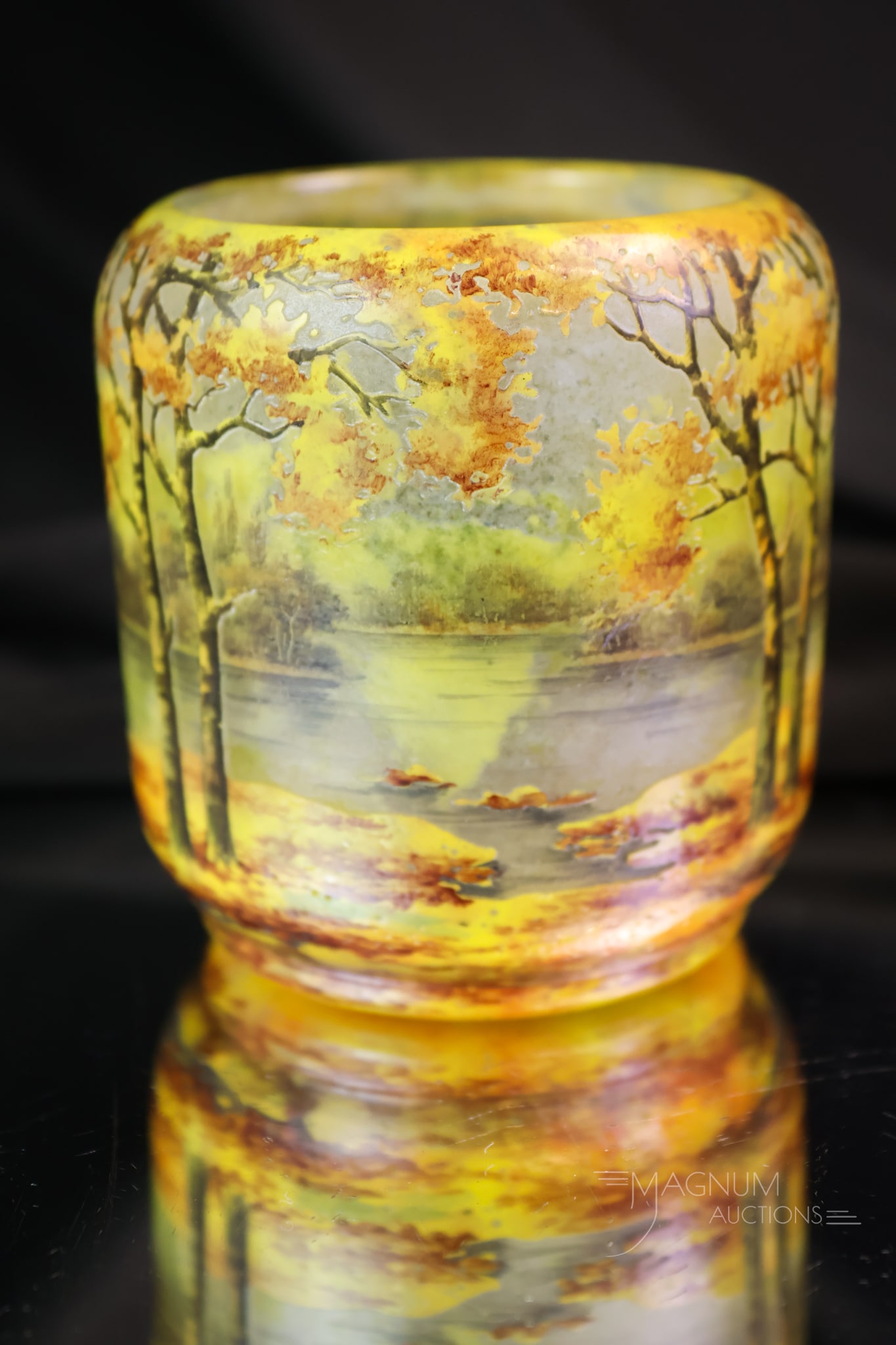 Signed Daum Nancy Cameo Glass Enamelled Art Glass Cabinet Vase: A sweet piece of Signed Daum Nancy French cameo enamelled art glass. This cabinet vase features a fall season decoration with a forest. The vase measures 3 1/2" tall.