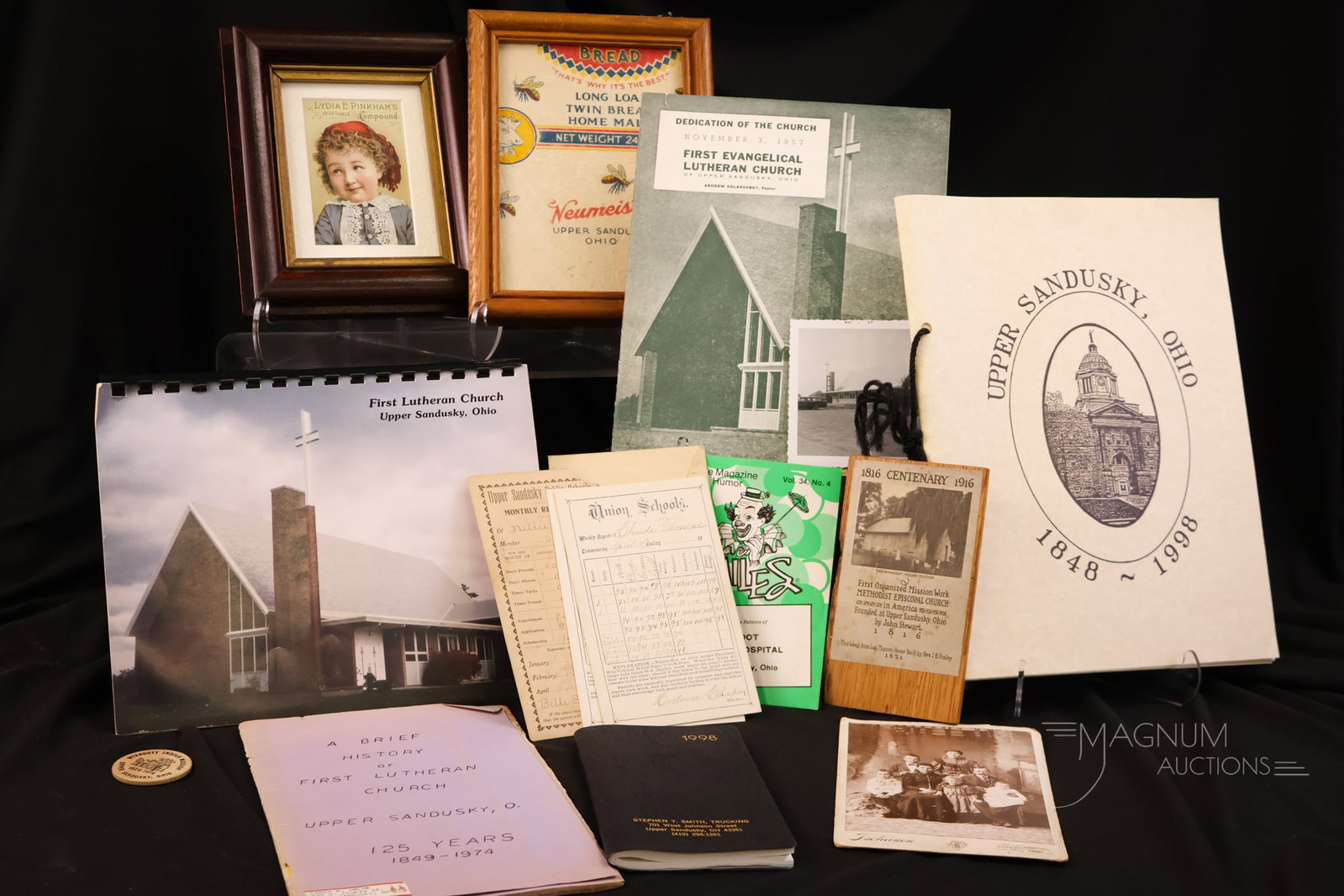 13 pc Lot Upper Sandusky Paper Paraphernalia Advertising & More: A thirteen-piece lot of Upper Sandusky, OH paper paraphernalia. This lot includes two framed advertisements for Neumeisters and an old Von Stein-Berg druggist as written by Mr. Long, in his hand. Ther