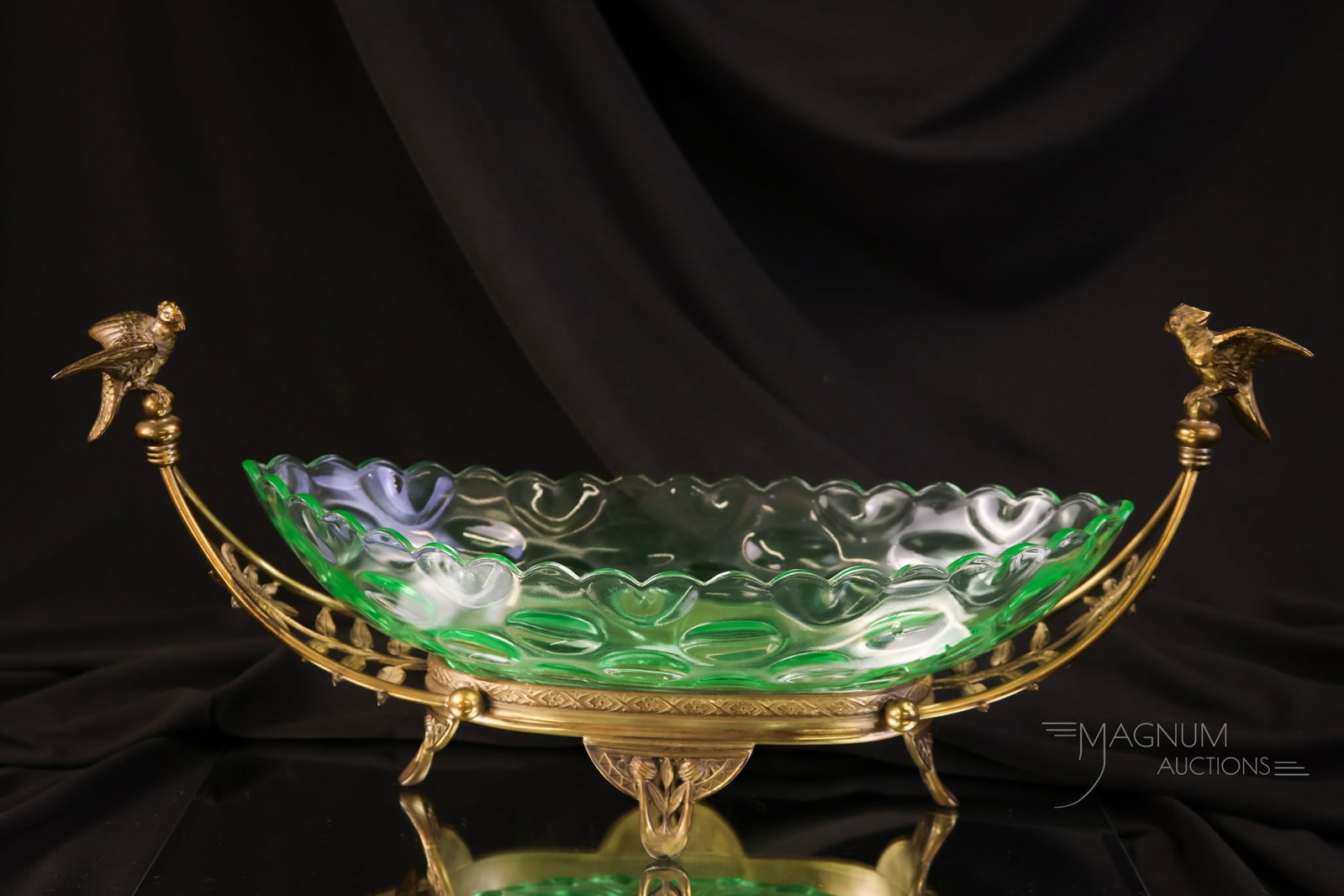 Victorian Duncan Marine Green Uranium Glass Silverplate Celery Boat: A gorgeous Marine green Duncan glass celery boat in an unmarked silverplate holder. This piece glows brightly under black light. The figural holder has two birds accenting it. The piece measures 6 1/2