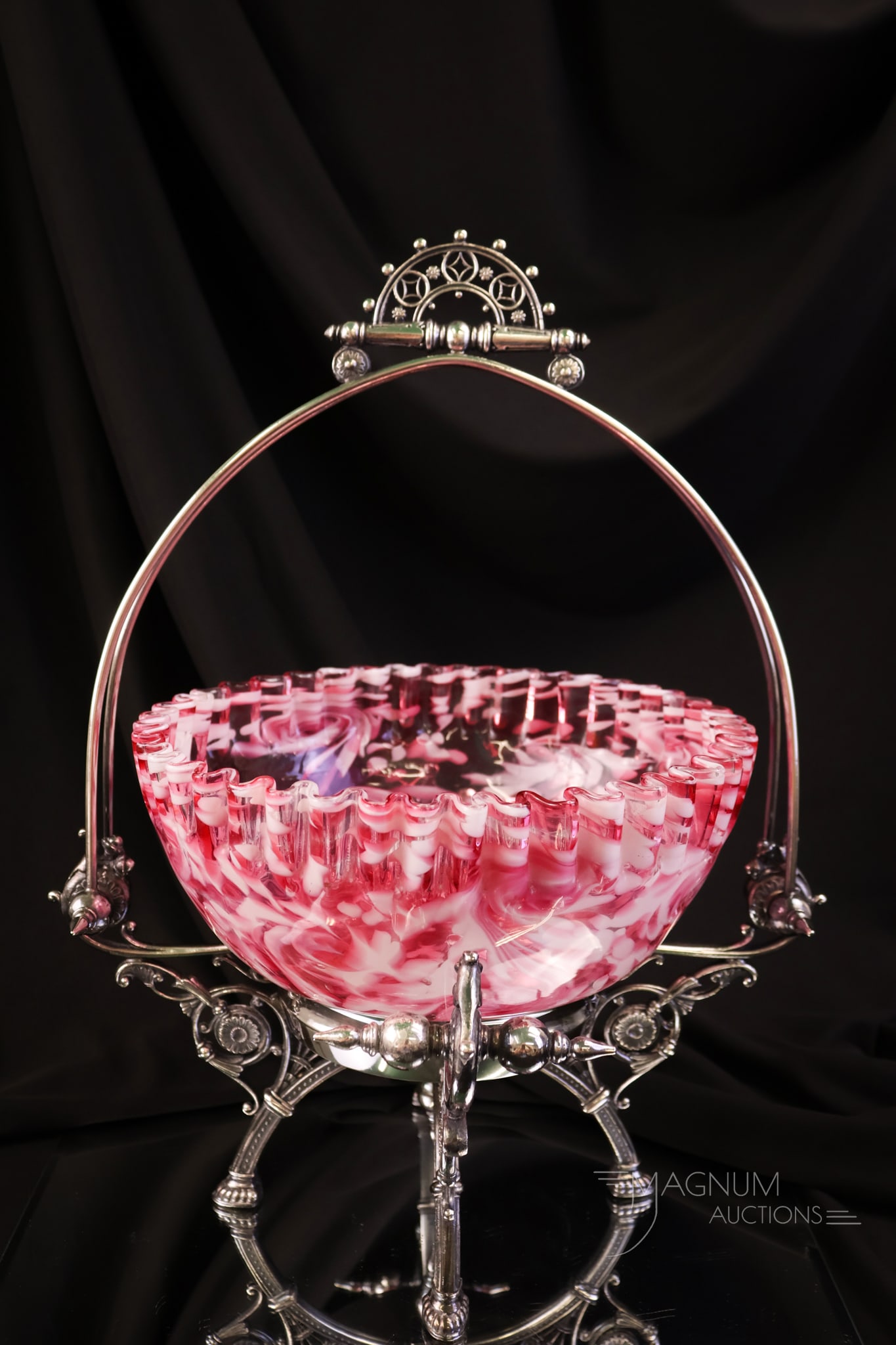 Tufts Silverplate Cranberry Spatter Victorian Brides Bowl Centerpiece: A beautiful find in a piece of Victorian art glass and silverplate. The holder is signed James Tufts and features an ornate four-footed design. The bowl is cranberry and white spatter glass. The piece