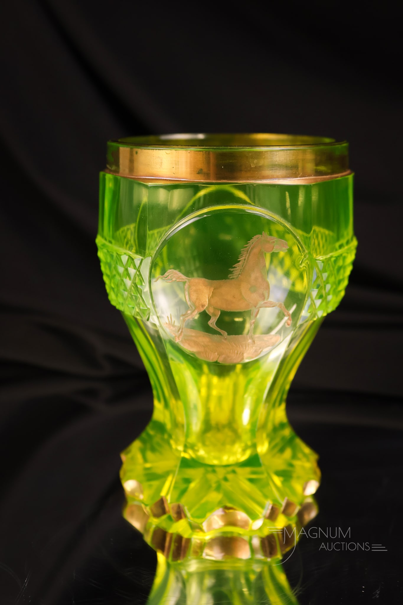 Bohemian Cut Engraved Vaseline Uranium Biedermeier Beaker Equestrian Theme: An amazing find in an antique vaseline uranium glass beaker. This is a Biedermeier cut and engraved glass example. It glows brightly under black light. It features a deep-cut base foot and an engraved