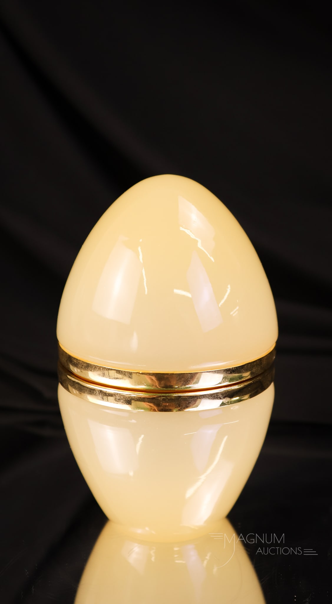 Italian Uranium Opaline Glass Hollywood Regency Jewelry Box: A beautiful glowing find in an Italian Hollywood Regency-style jewelry casket. This is in opaline glass and in an egg form. The casket measures 4 1/2" tall.