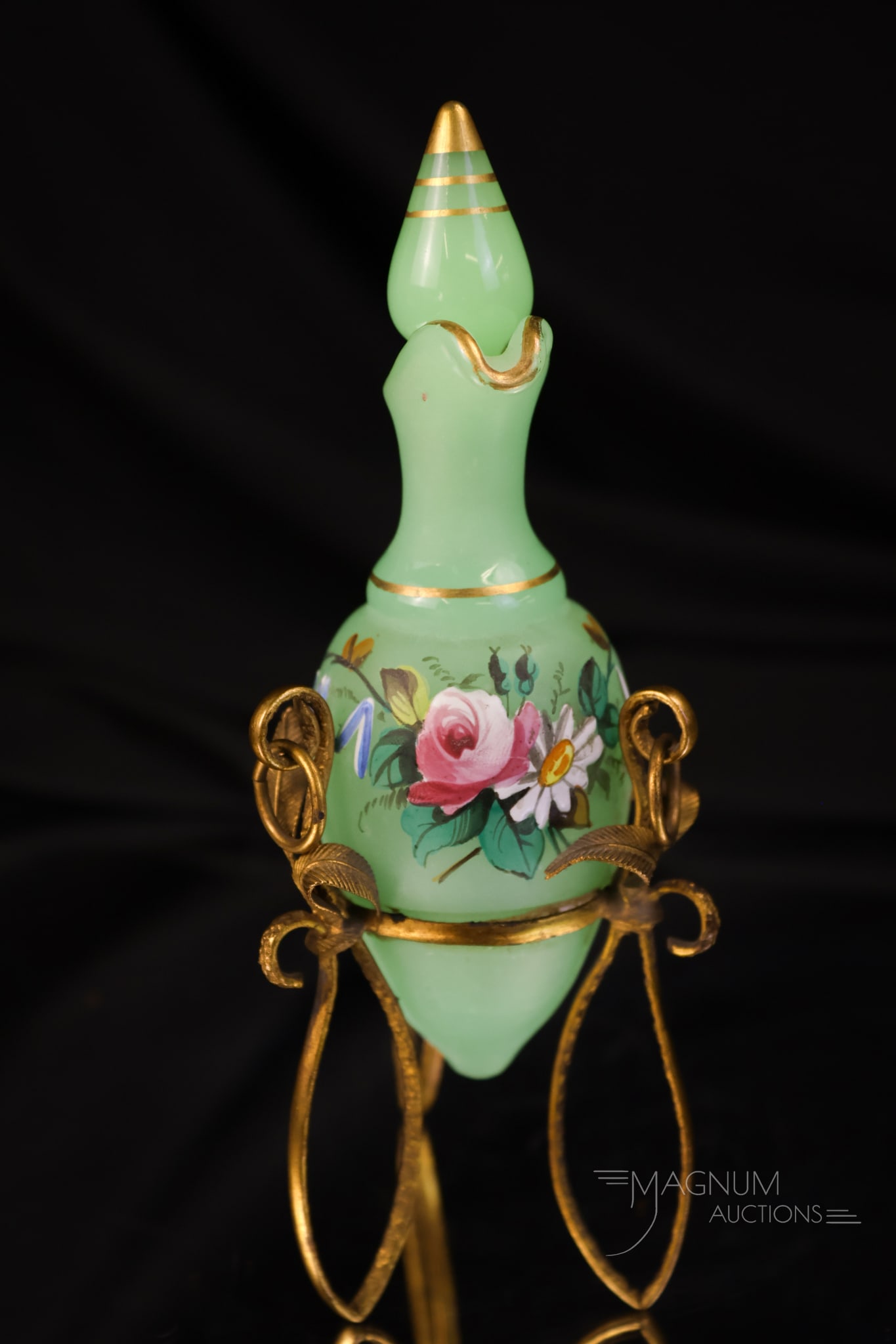 French Jade Green Opaline Uranium Ormolu Enamel Decorated Cruet: A glowing find in French jade green opaline uranium glass. This is a diminutive cruet with ormolu trim and enamel decoration. The ormolu trim has leaf trim. The cruet retains the original stopper. The