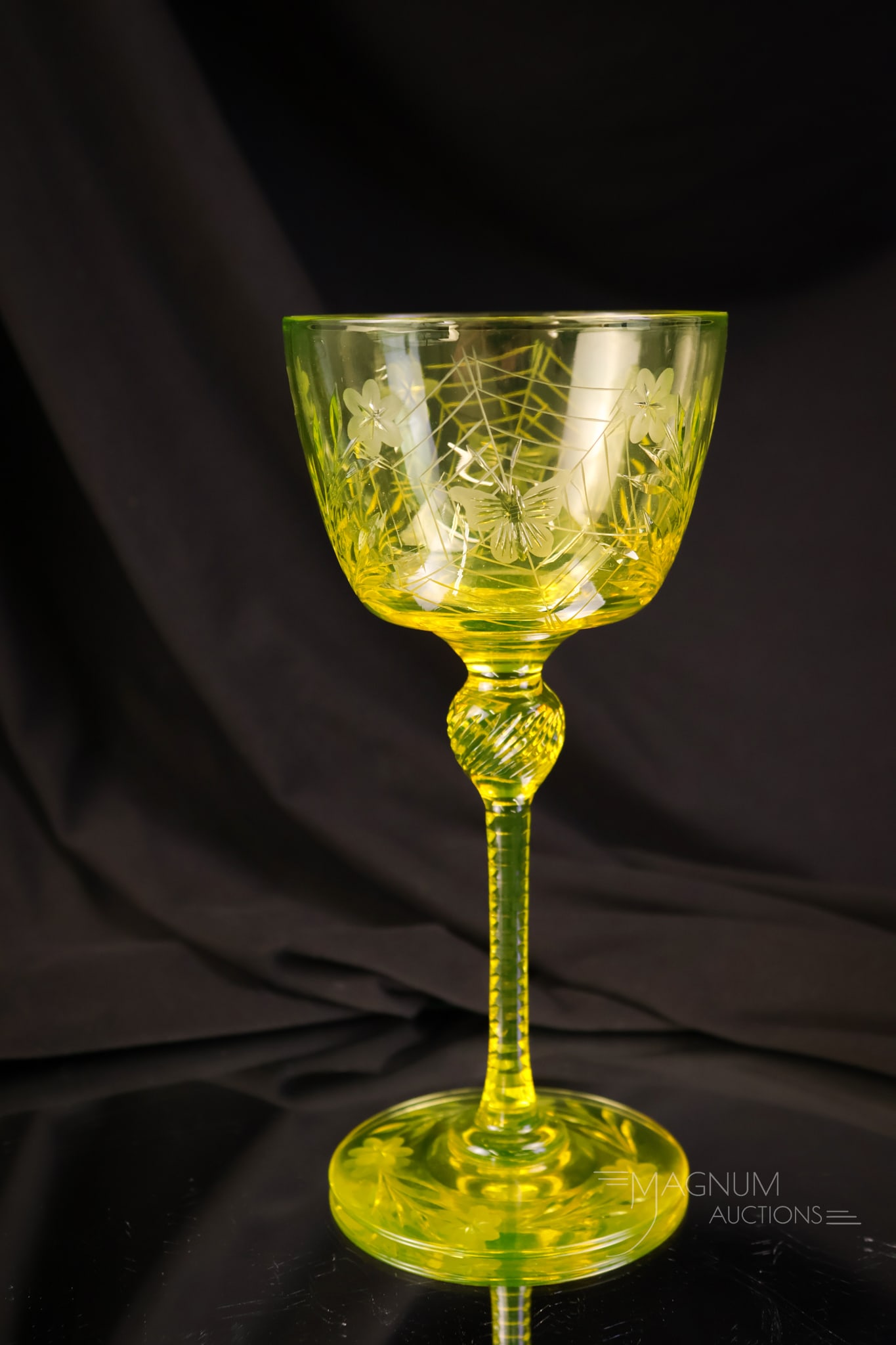 Pairpoint Canaria Vaseline Uranium Glass Colias Cocktail Stem: A beautiful example of a highly sought-after Pairpoint Colias vaseline uranium Canaria stem. This is a cocktail stem. It measures 7" tall and 3 1/4" wide. It glows brightly under black light.