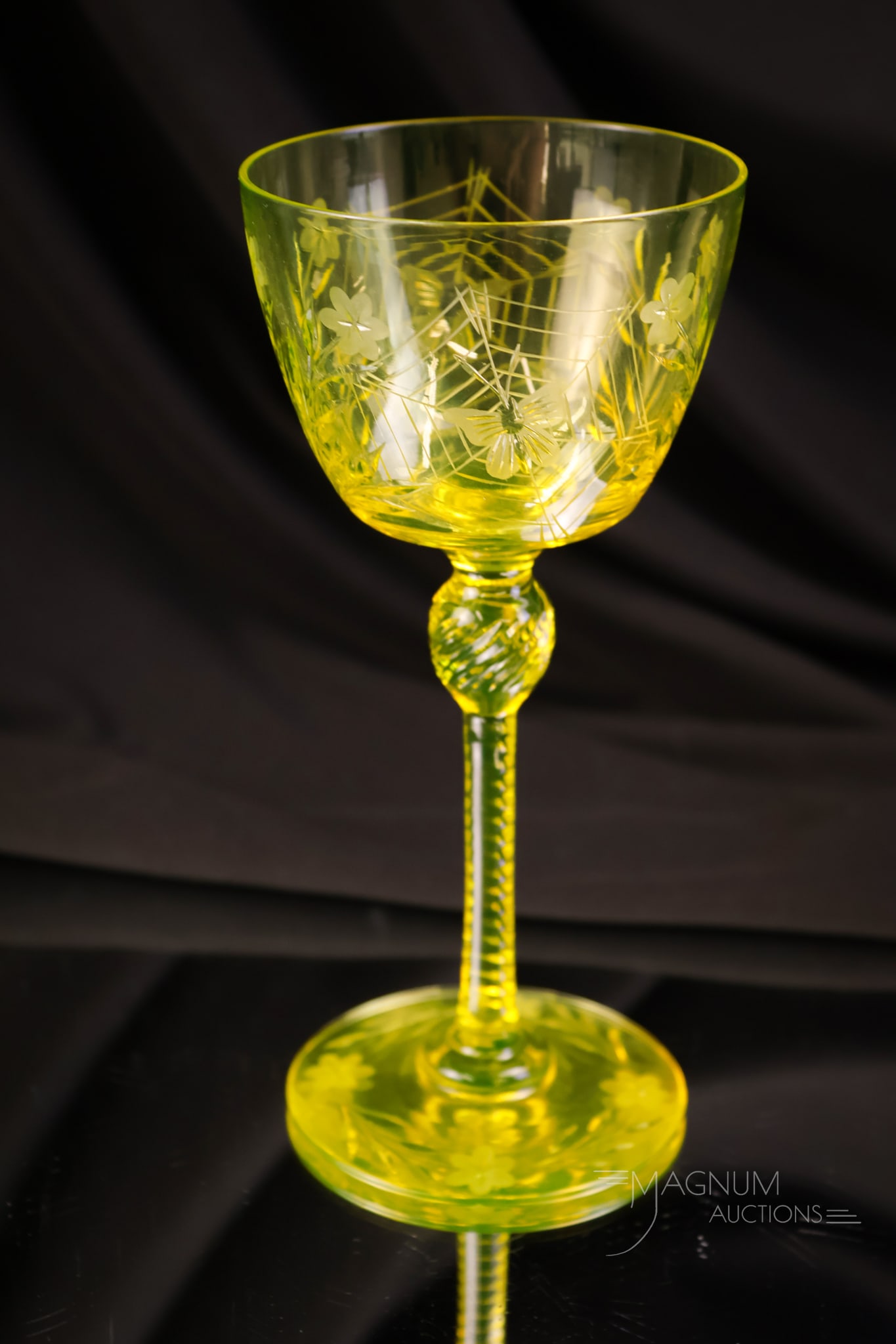 Pairpoint Canaria Vaseline Uranium Glass Colias Cocktail Stem: A fine example of a Pairpoint Canaria vaseline uranium-rich cocktail stem. This is in the Colias pattern. This super find glows brightly for all the right people who care. It measures 7" tall and 3 1/