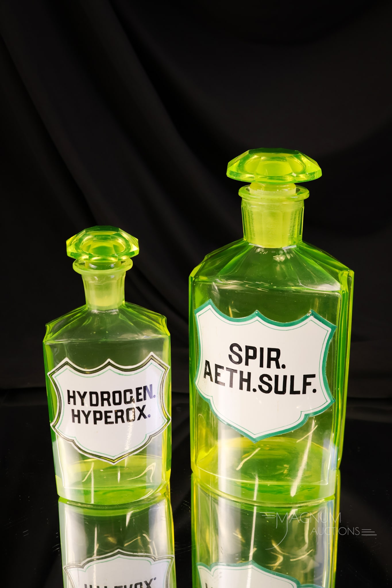 2 pc Lot Antique Vaseline Uranium Glass Enamelled Apothecary Bottles: Two unique finds in antique vaseline uranium-rich enamelled glass apothecary bottles. Each has an enamelled label of the chemical it once held. The tallest measures 8".