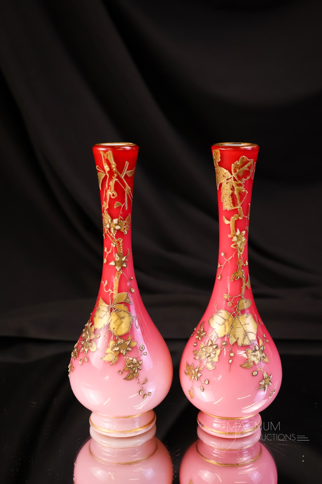 Pair Harrach Peachblow Uranium Victorian Glass Gilt Diminutive Vases: A fine pair of diminutive Victorian art glass attributed to Harrach peachblow uranium-rich art glass vases. Each of these if gilt decorated. Each measures 5 3/4" tall.