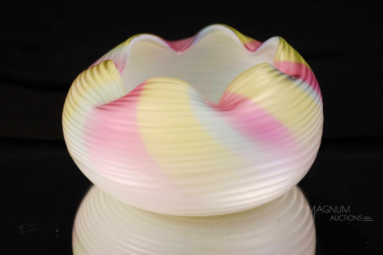 Rainbow Victorian Uranium Mother of Pearl Satin Glass Rings Pattern Rose Bowl: A beautiful pastel rainbow mother-of-pearl satin glass rose bowl in a concentric rings pattern. This rose bowl glows brightly with its uranium content. The piece measures 2" tall and 4 1/2" wide.