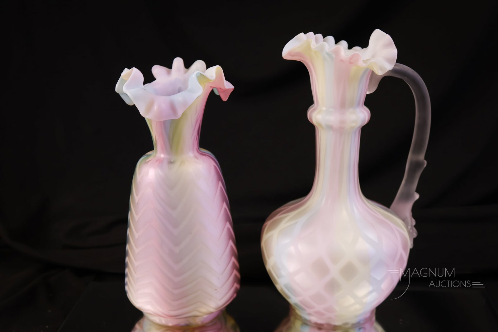 2 pc Lot Rainbow Mother of Pearl Satin Glass: Two pieces of rainbow Victorian mother-of-pearl satin glass that have endured the test of time. The first is a thorn-handle ewer. The second is a ruffled Herringbone-patterned vase. The tallest