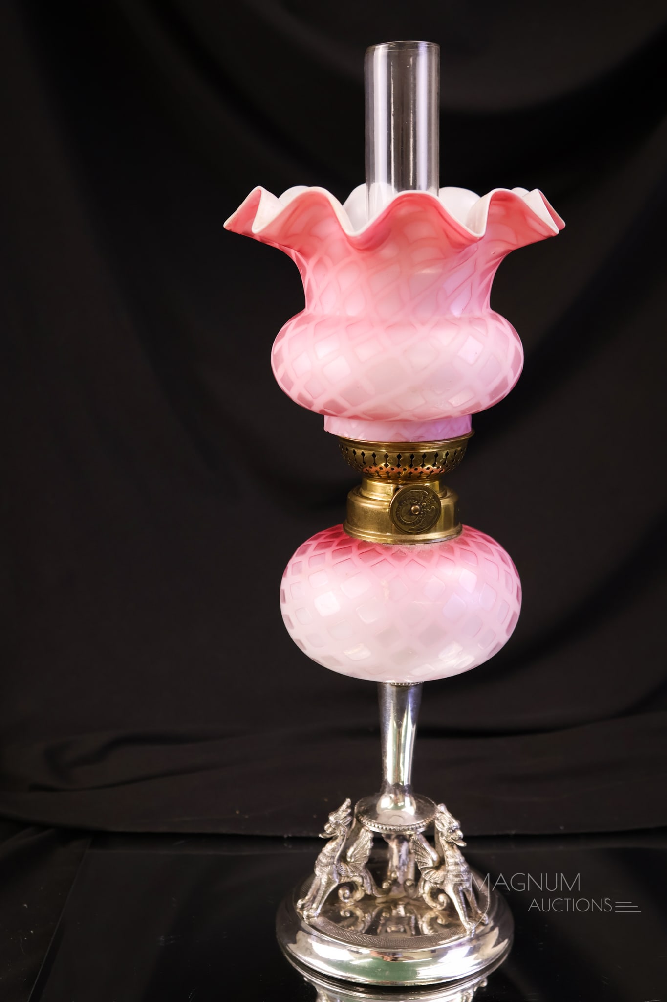 Victorian Mother of Pearl Satin Diamond Quilted Miniature Oil Lamp: A striking English hallmarked silverplate and Victorian satin mother-of-pearl diamond-quilted miniature oil lamp. This piece features three dragons at the base. The lamp has exquisite coloring. It mea