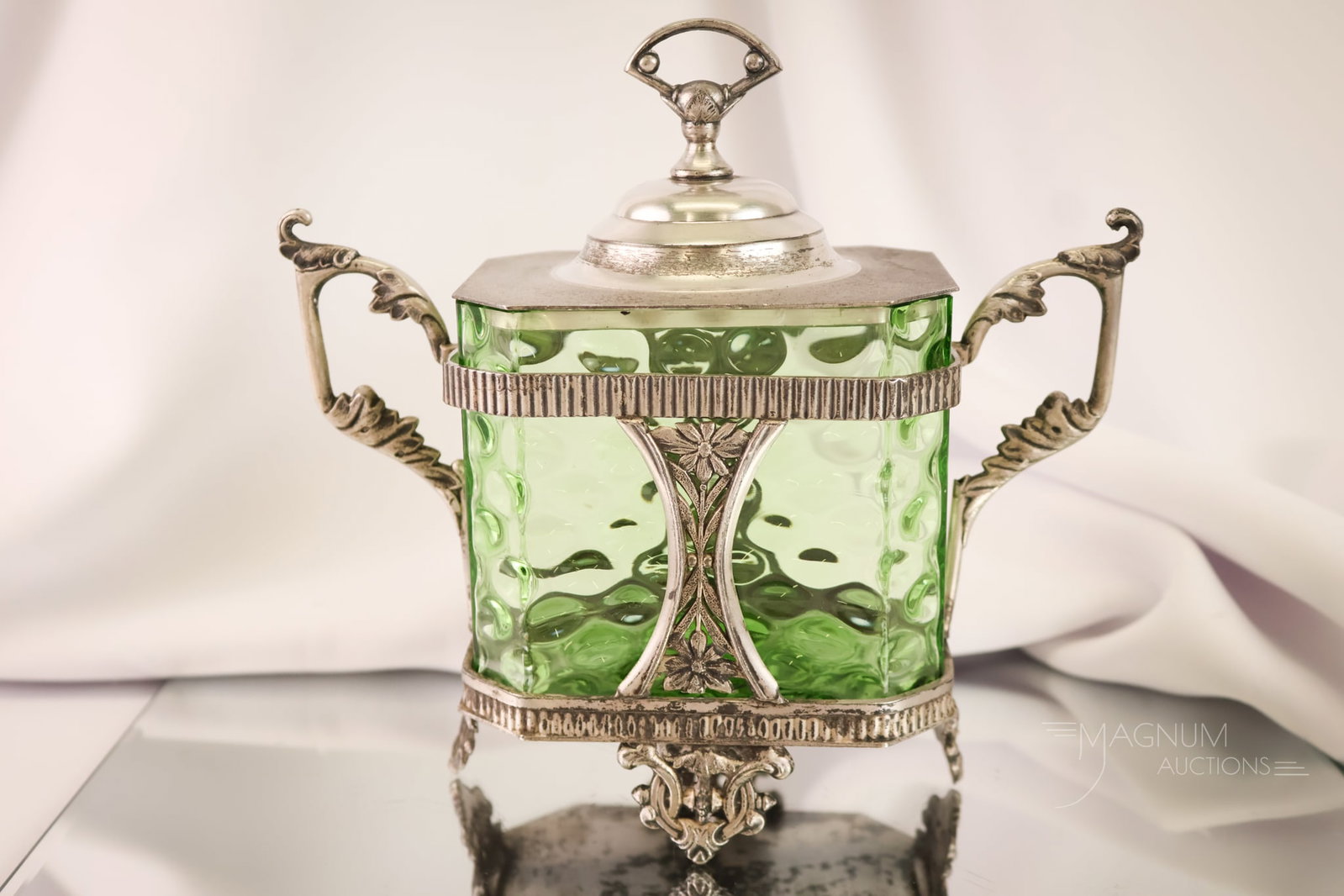 Rare Victorian Silverplate Vienna Sausage Olive Green Glass Castor: A beautiful and unusual find for your collection. This is an olive green glass and silverplate Vienna sausage castor. This piece features a rectangular glass jar and ornate silverplate frame and lid.