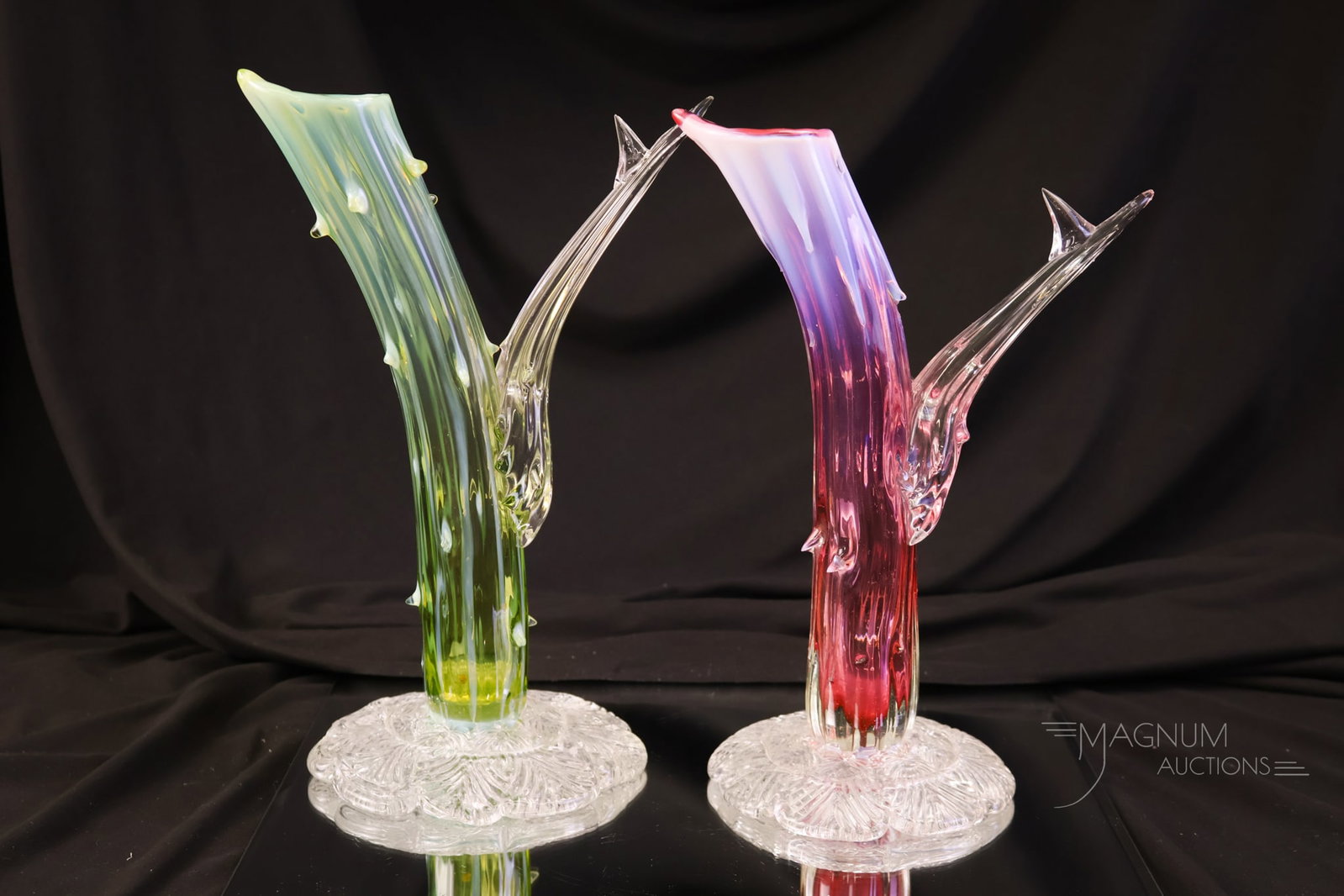 Pair of English Victorian Thorny Glass Vases: A fine matched pair of English thorny art glass applied vases. One is in a green opal stripe. The other is in a cranberry opal stripe. Each measures 10" tall.