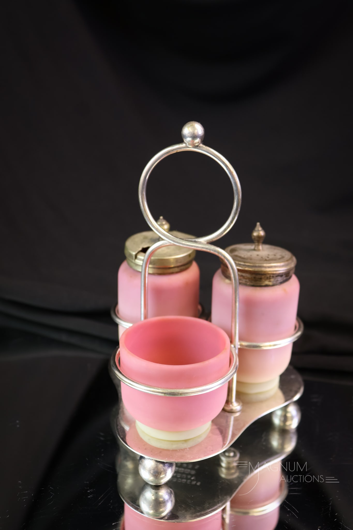 EPNS Silverplate Webb Burmese Glass Condiment Shaker Set: A Victorian marked E.P.N.S. silverplate Victorian condiment set with Webb bumese glass. This set has a shaker, mustard jar, and an open salt in the holder. The set measures 5 1/2" tall.