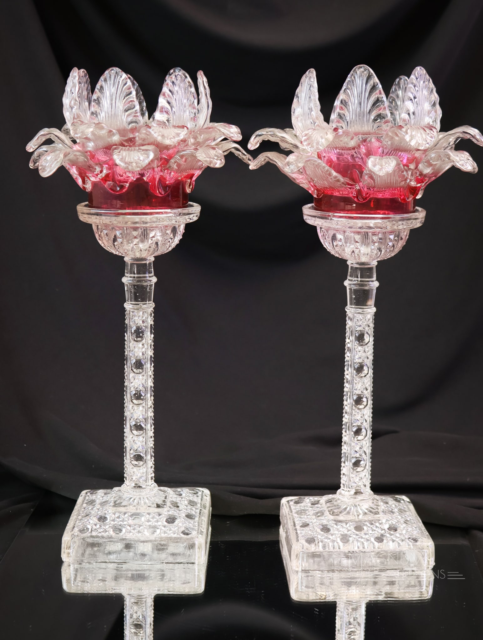 Pair Pedestal Victorian Art Applied Glass Fairy lamps: A beautiful matched pair of Victorian applied art glass fairy lamps on pedestal form bases. Each measures 12" tall and 5 1/2" wide. Each shade is in cranberry glass with applied clear petals. The