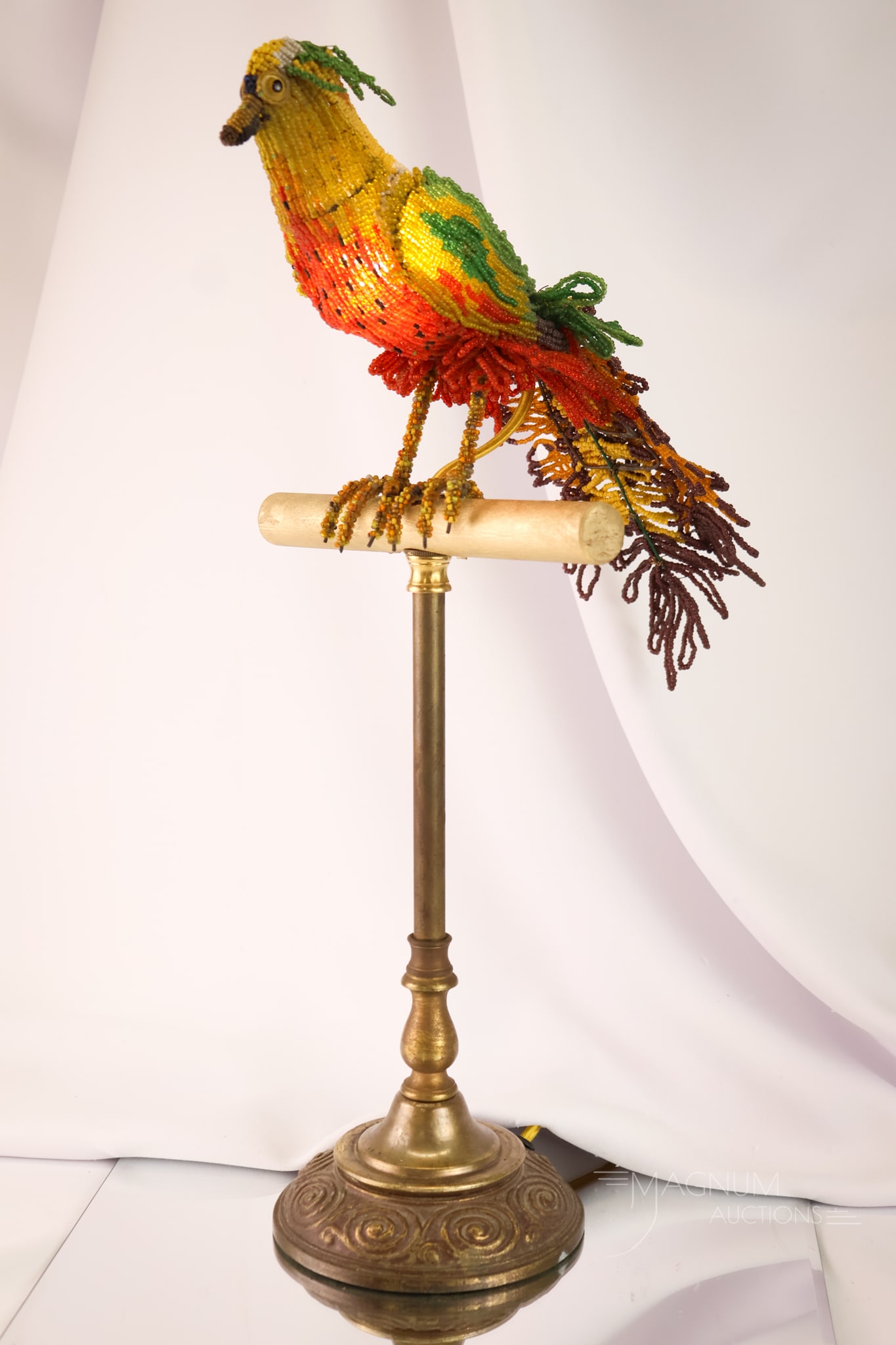 Antique Art Deco Czech Glass Beaded Parrot Table Accent Lamp: A novelty find for your collection. This is an Art Deco Czech glass-beaded figural parrot lamp. The parrot is in a multitude of colors and is perched on a gilt wood perch. The lamp measures 18" tall