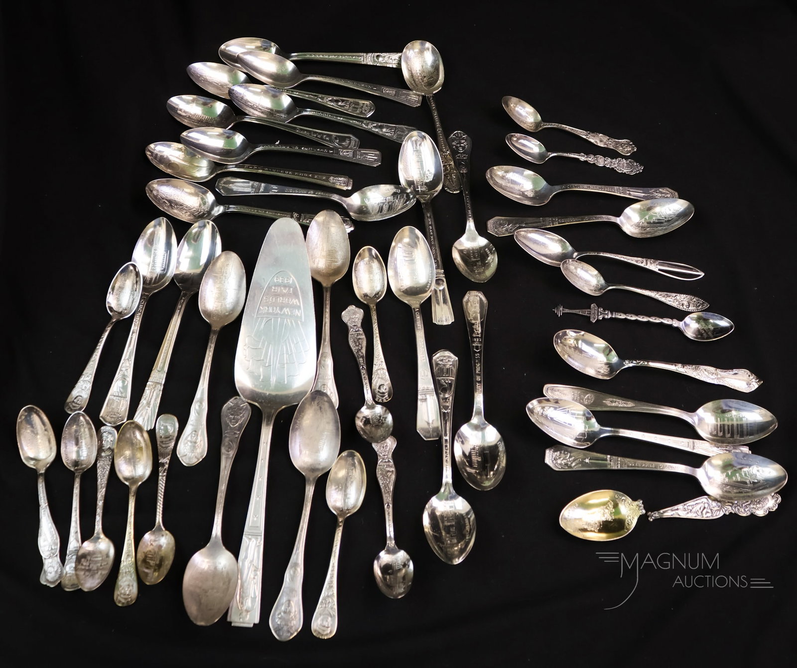 44 pc Lot Antique World's Fair Collectible Spoons & More Lot Sterling 7.324OZT: A generous offering of 44 pieces of World's Fair Souvenir spoons. There are 12 sterling spoons with a weight of 7.324 OZT in the lot. The remaining 32 pieces are silverplate. One of which is a server.