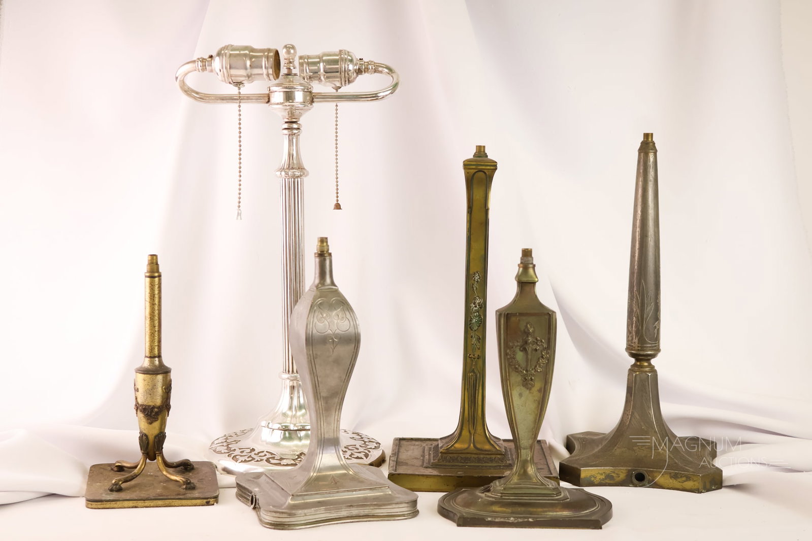 6 pc Lot Pairpoint Reverse Painted Puffy Table Lamp Bases: A generous offering of six signed Pairpoint reverse-painted puffy table lamp bases. Each is unique in form. The tallest measures 17 1/2".