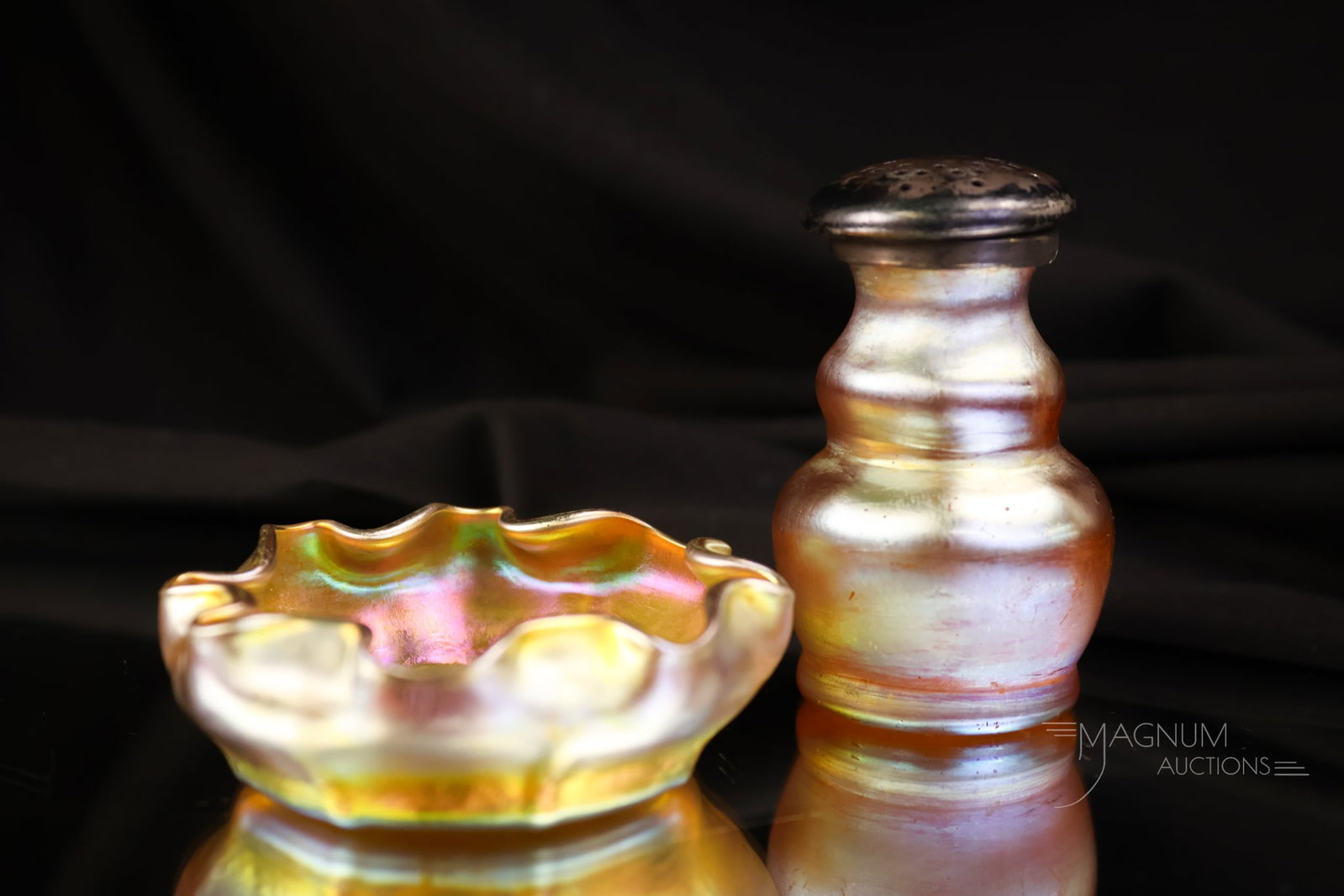 2 pc Lot signed Tiffany Gold Favrile Glass Salt Shaker & Open Salt: Two desirable finds in signed Tiffany Favrile art glass. This lot includes a ruffled open salt marked "L.C.T." There is also a rarely found salt shaker. It is marked "L.C.T. Favrile, 8676". The