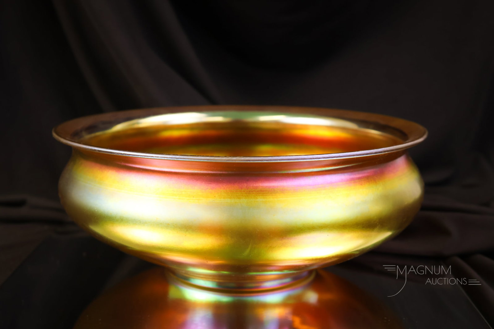 Signed Steuben Gold Aurene Console 10" Bowl: A signed Steuben gold aurene console bowl. This fine example measures 4" tall and 10" in diameter. It is made of gold iridescent glass. The bowl is marked "Steuben Aurene 3183."
