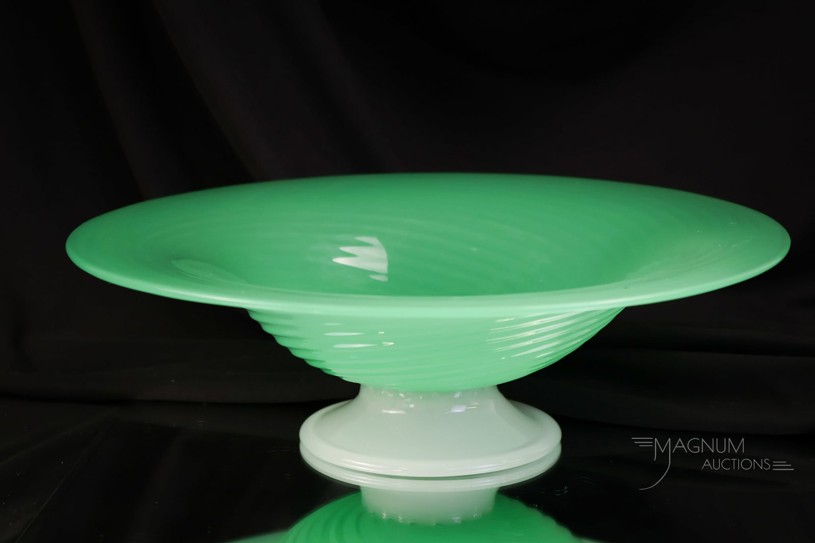 Steuben Jade & Alabaster 11 1/2" Art Glass Footed Bowl: A nice find in a Steuben Jade and Alabaster footed bowl. This one is in a swirl pattern. The bowl measures 3 1/2" tall and 11 1/2" wide.