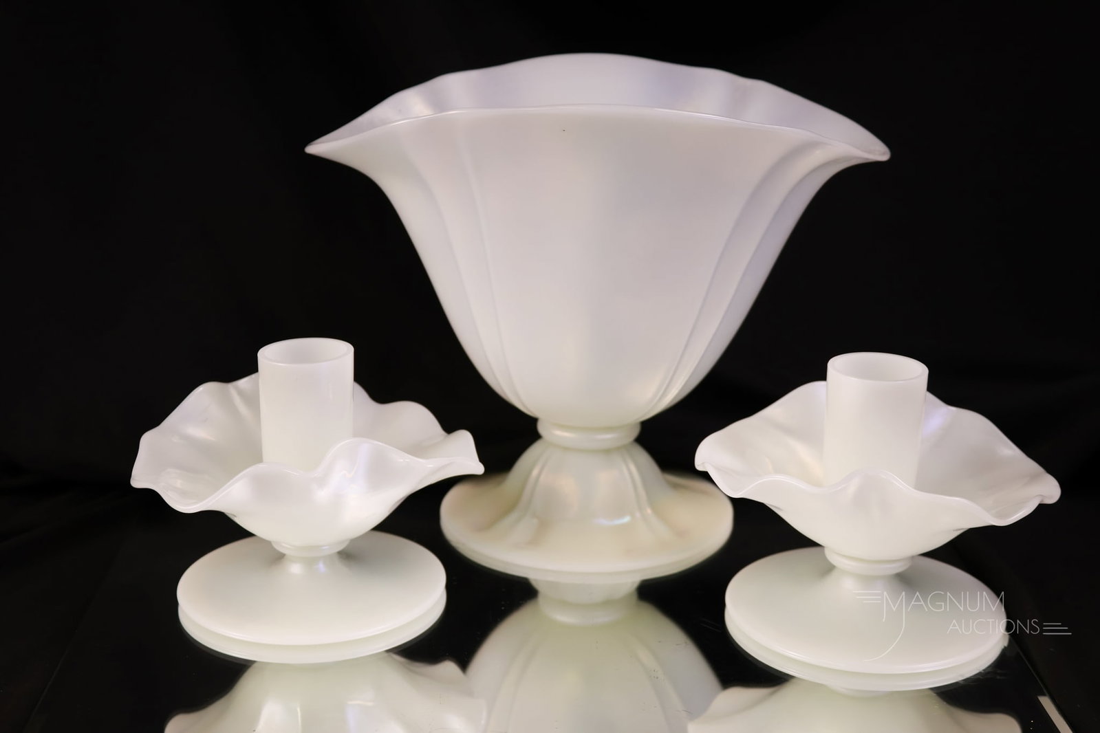 3 pc Lot Steuben Ivrene Art Glass: A very nice lot offering three pieces of Steuben Ivrene art glass. This lot includes a footed flared vase along with a pair of candlesticks. The tallest measures 6".