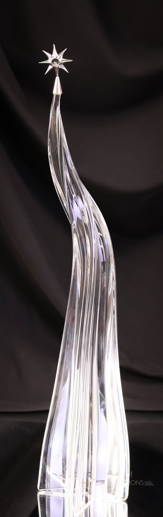 Steuben Crystal Art Glass Abstract Christmas Tree: A Steuben abstract crystal art glass Christmas tree.This is complete with the star topper. The tree measures 12 1/2" tall. The piece is complete with the original box.