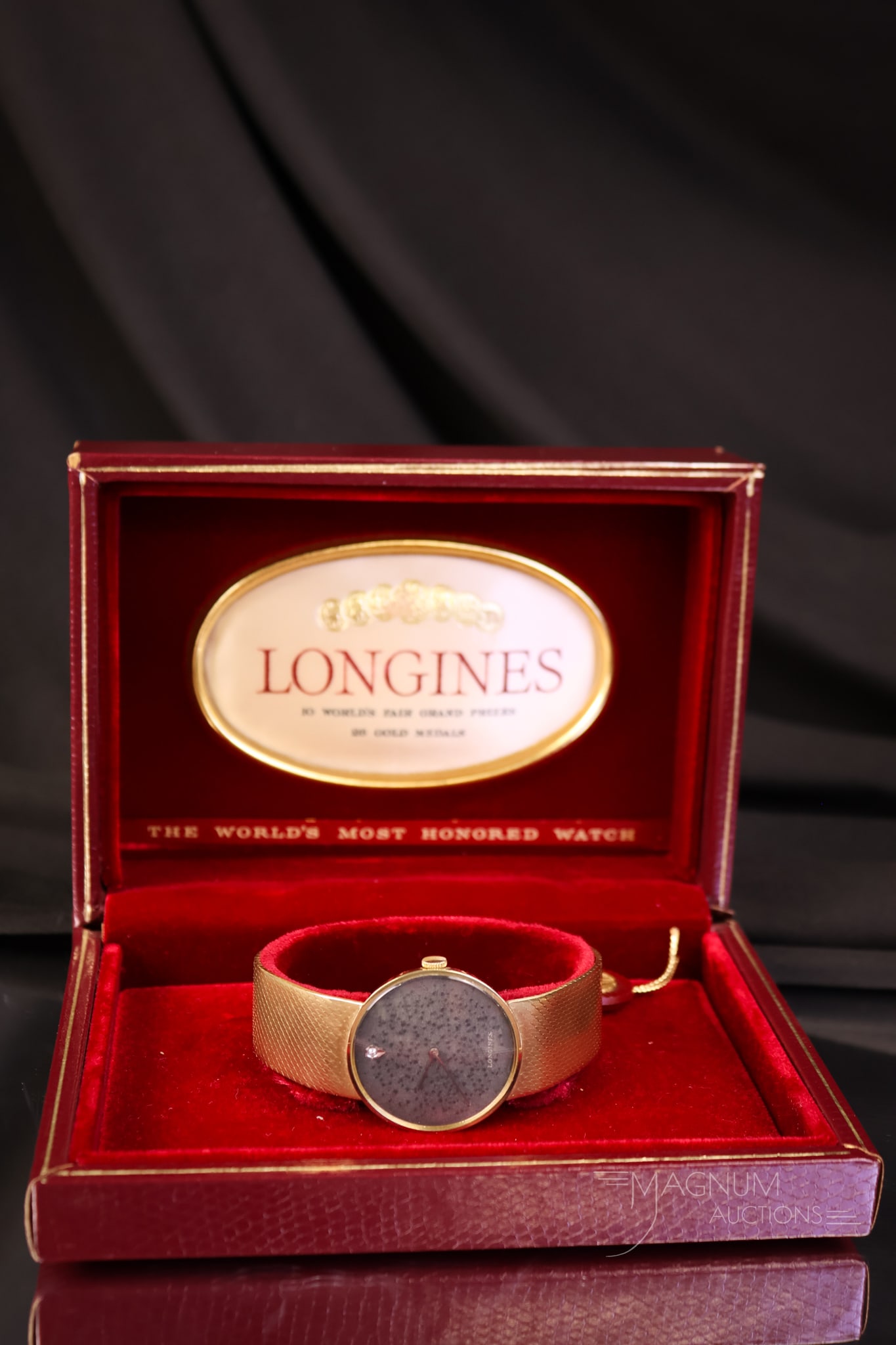 Longines 14K Gold Band & Case Wristwatch 1.860 OZT WIRE TRANSFER ONLY: THIS LOT MUST BE PAID VIA WIRE TRANSFER OR CASH ON PICKUP ONLY. This is a fine Longines 14K gold case and band wristwatch. The weight is 1.860 OZT. The watch features a single diamond on the dial. The