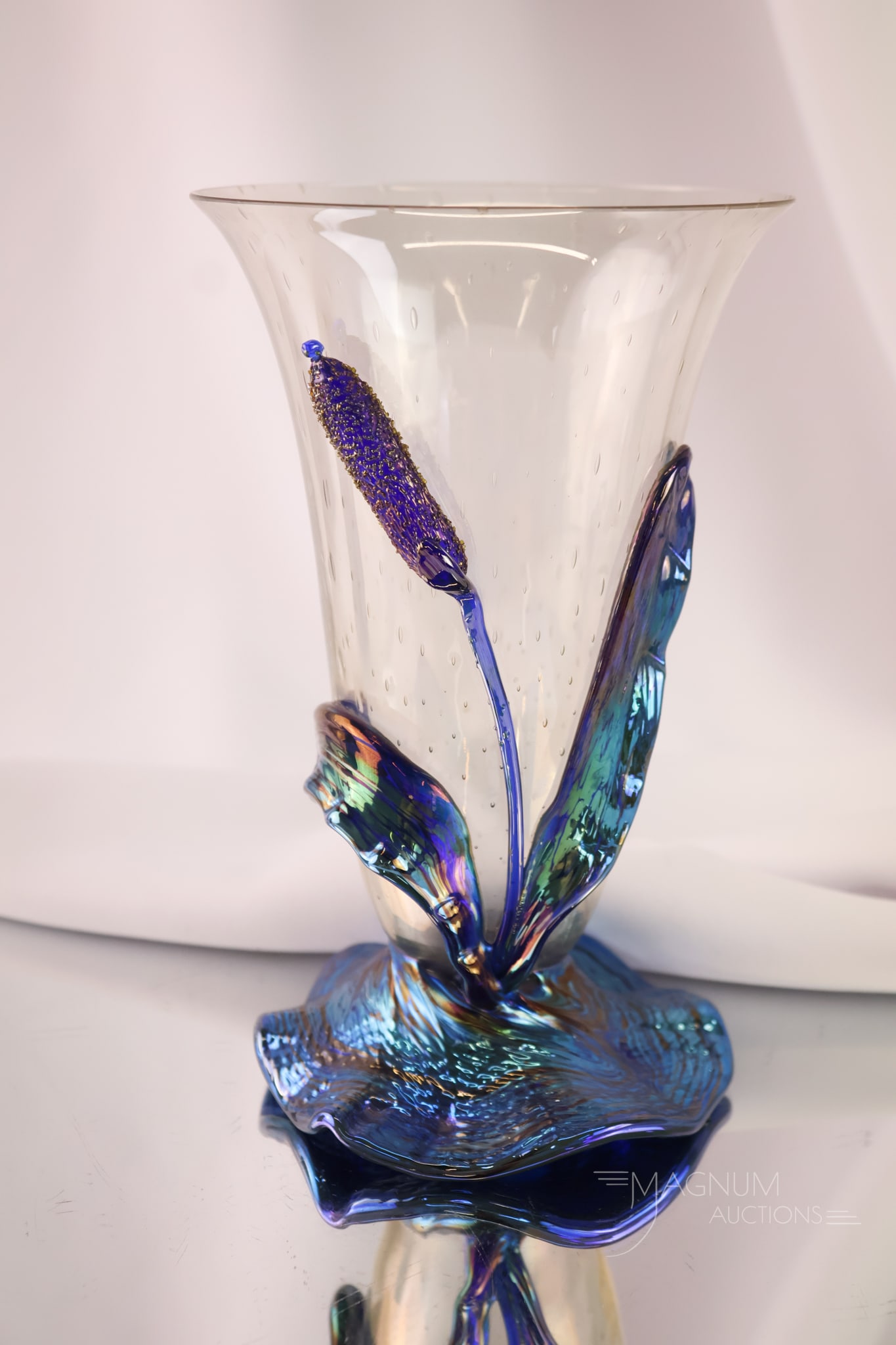 Loetz Art Nouveau Glass Vase Electric Blue Cattails and Controlled Bubble: A Loetz Art Nouveau glass vase that is extraordinary. The vase body features a controlled bubble. The vase is decorated with blue iridescent cattails on the base. The piece has electric coloring. It m