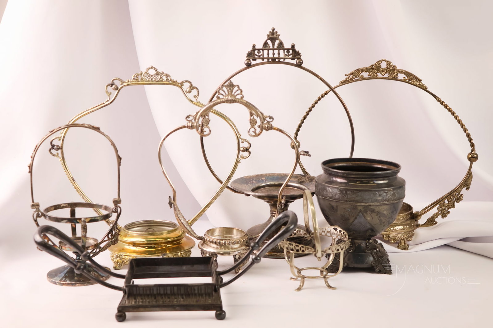 8 pc Lot Victorian Silverplate HoldersArticles: Eight highly sought-after finds in Victorian silverplate holders. Makers include Tufts, Wilcox, and more. All holders are as found. The tallest measures 14".
