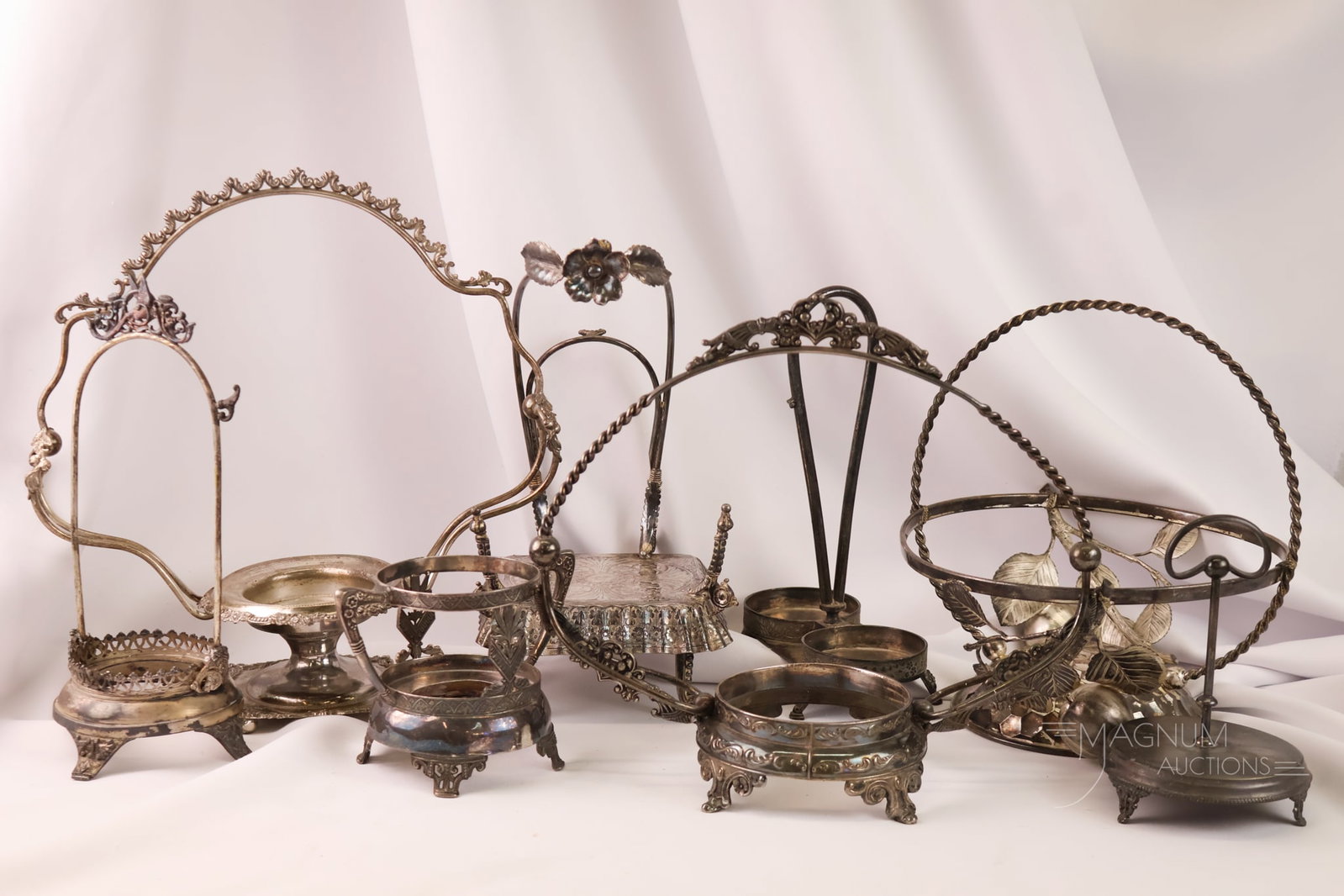 8 pc Lot Victorian Silverplate Holders & Articles: A genrous array of Victorian silverplate articles and holders. Makers include Webster, Tufts, and Meriden. All are as found. The tallest measures 13 1/2".