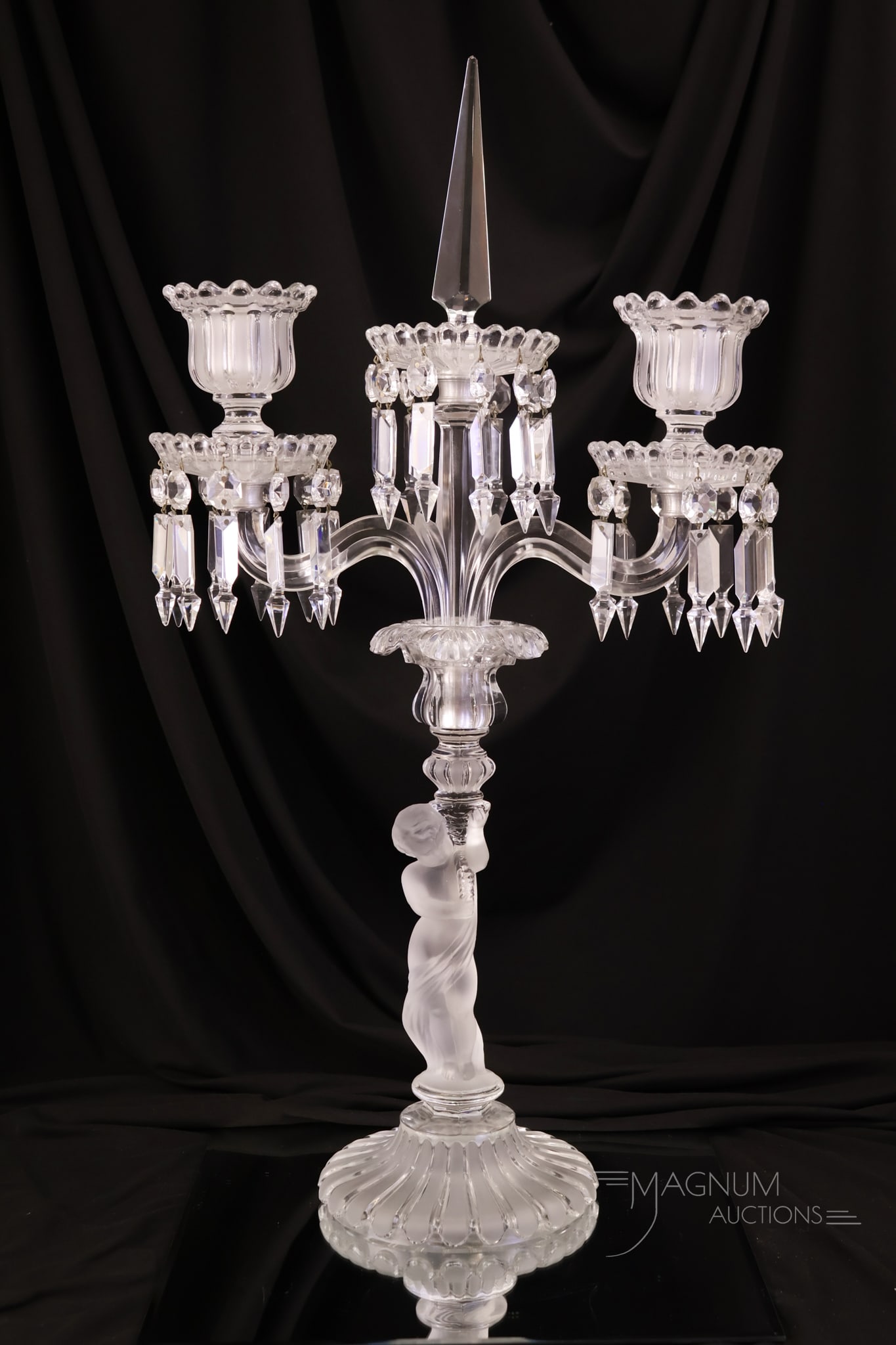 Baccarat "Enfant" Frosted Crystal Candleabra: A gorgeous and rare find in Baccarat glass. This is an "Enfant" crystal frosted three-arm candelabrum. The piece features an obelisk in the center. The piece is signed with a Baccarat mark on the base