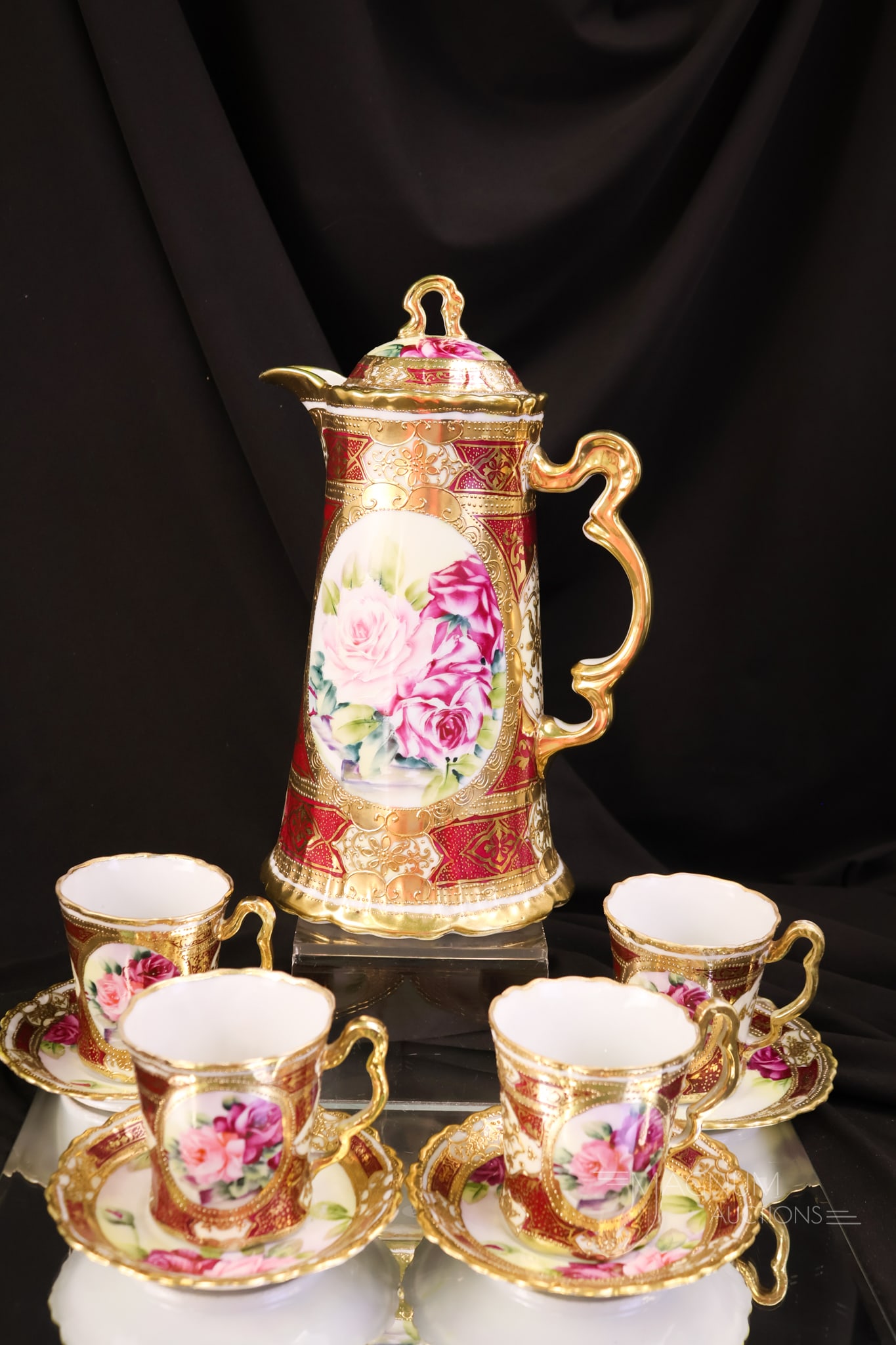 Blue Mark Nippon Rose Decorated 9 pc Coffee Set: A beautiful Nippon Blue Mark nine-piece coffee set. This set is decorated with pink roses and heavy gold. The tallest measures 10". One cup exhibits a hairline.