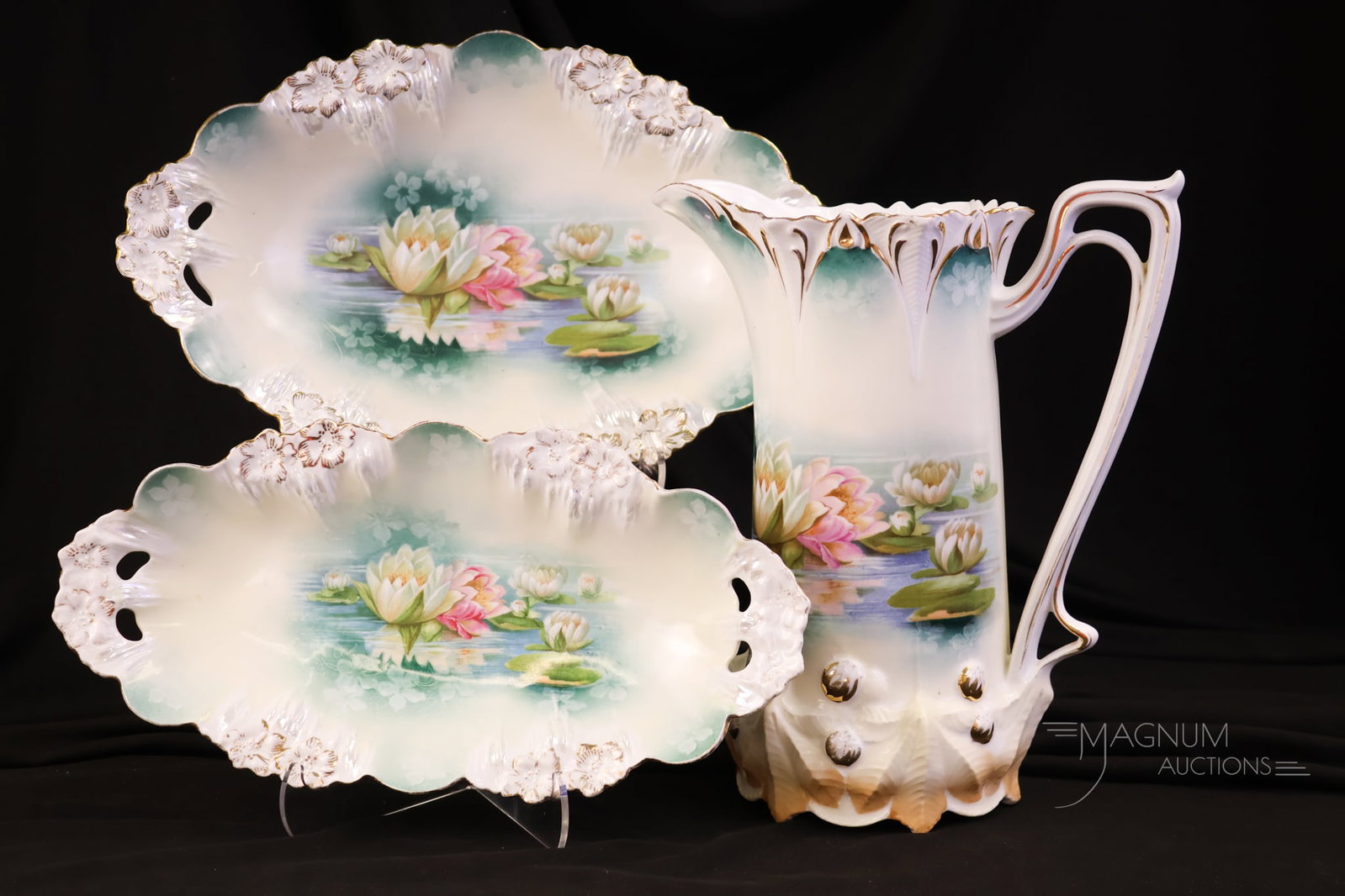 3 pc Lot R.S. Prussia "Waterlily" Mold Porcelain Pitcher & More: Three selections that are sure to please. This lot offers selections in the "Waterlily" mold. There is a pitcher, an oval tray, and an oval bowl. The tallest measures 10 1/2".