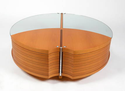 JAIME TRESSERRA CLAPÉS (Barcelona,: JAIME TRESSERRA CLAPÉS (Barcelona, 1943).Center table.Walnut wood, stainless steel and glass.With signature stamp."Beetle" table was sold in the Tresserra Collection for € 10,615 plus VAT.Measureme
